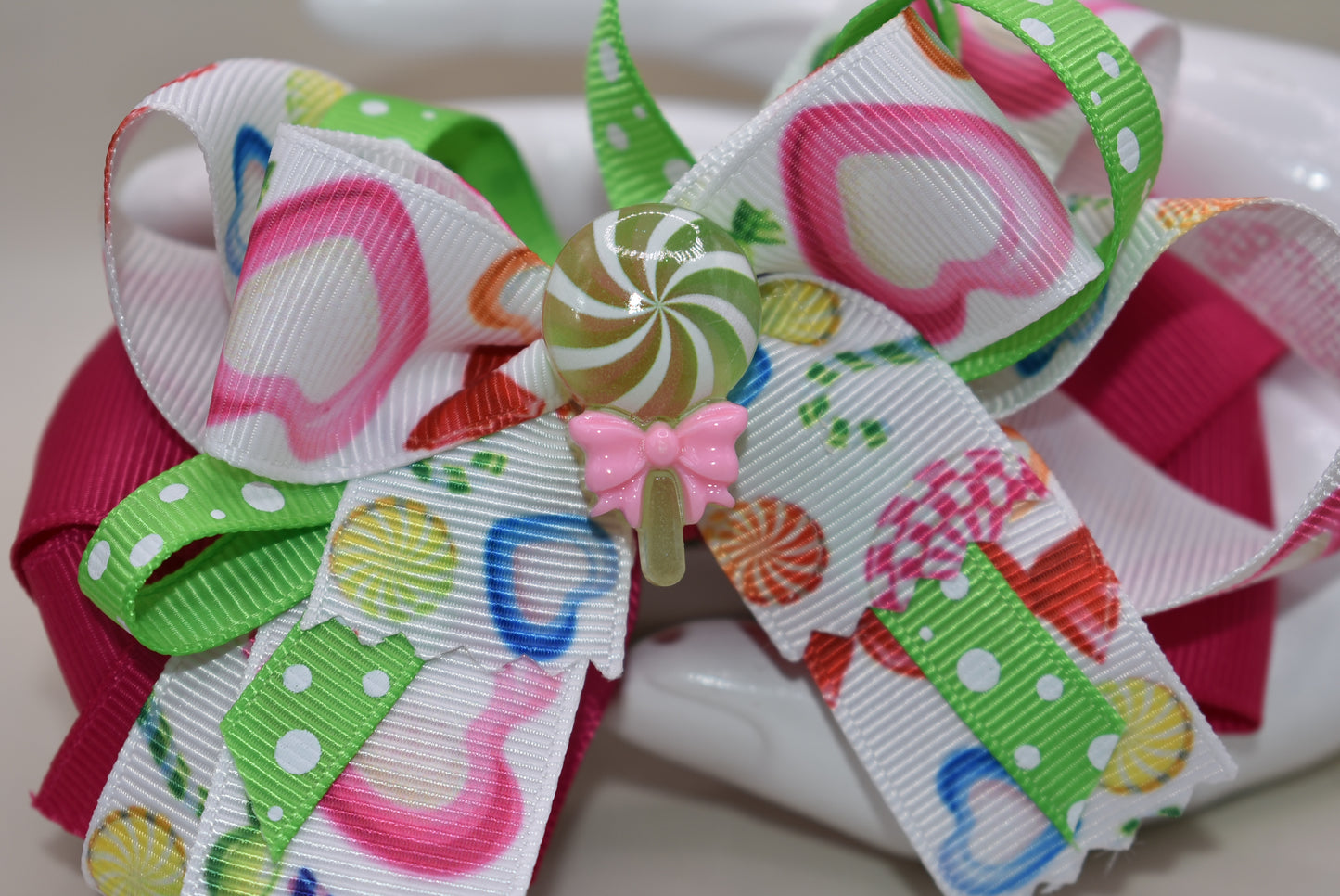 Introducing Nana's Collection 65 - the most fun and playful accessory for your little one! With a candy bow and adorable candy charm, this hair bow will add a touch of sweetness to any outfit. Your little one is sure to fall in love with this cutie and have endless fun wearing it! 🍭