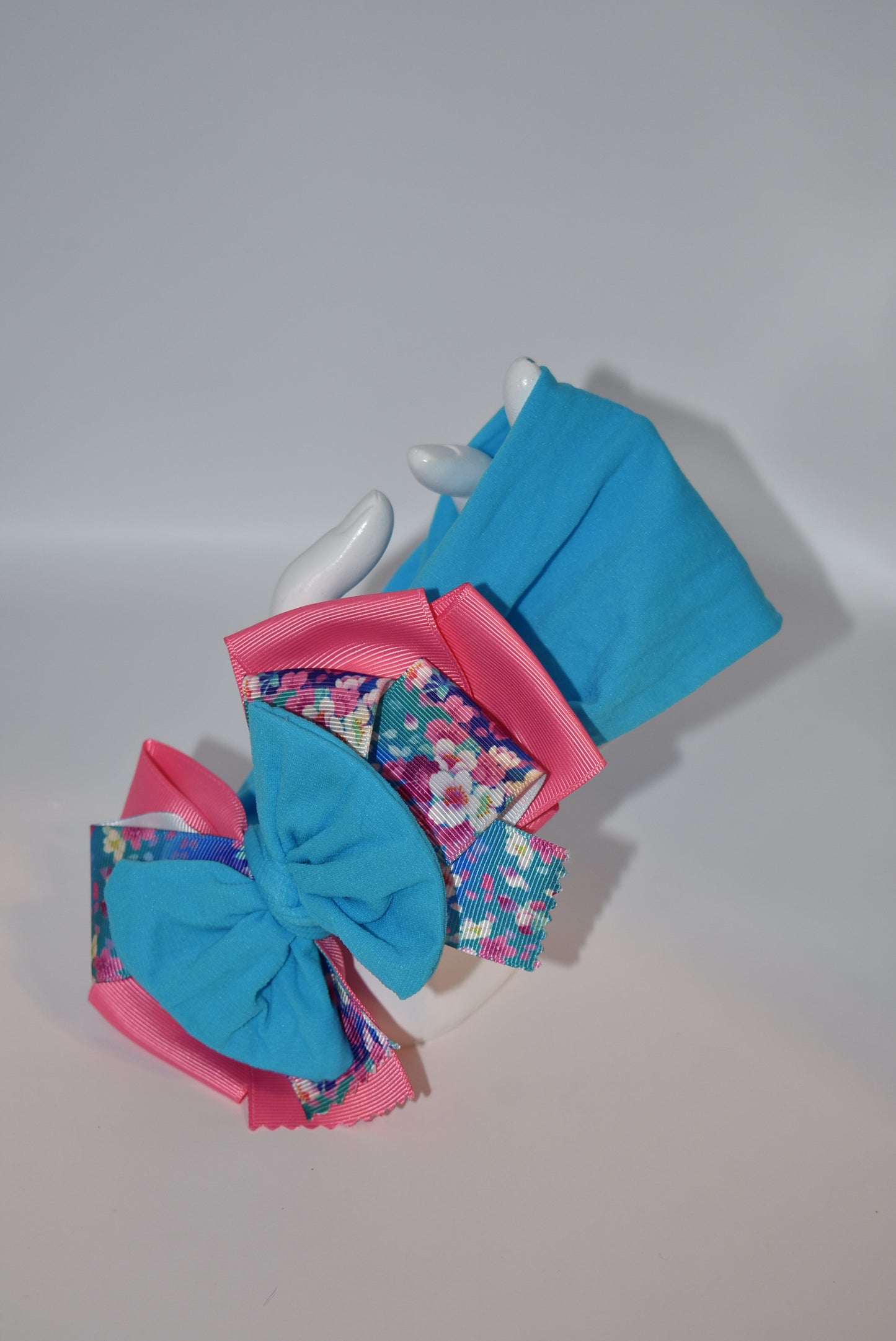 Add a splash of fun to your look with this Wrapped Headband from our Collection 4! π Featuring soft pink and blue hues and a charming flower motif πΈ, itβs perfect for anyone who loves a cheerful pop of color. One-of-a-kind and delightfully playful, this headband brightens any outfit with a touch of whimsy! β¨