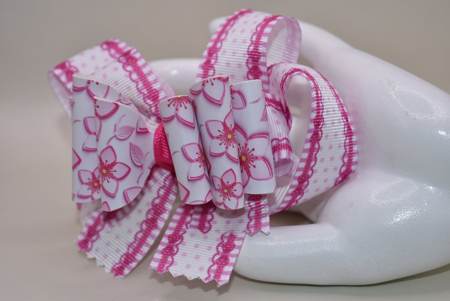 Add a pop of playful charm with this Nana' Collection 100 hair clip! Featuring a pretty pink flower made from soft faux leather, itβs perfectly framed by matching grosgrain ribbon for extra sweetness. The wrapped alligator clip ensures a comfy, secure hold all day long. πΈπβ¨ Perfect for brightening up any hairstyle with a touch of fun!