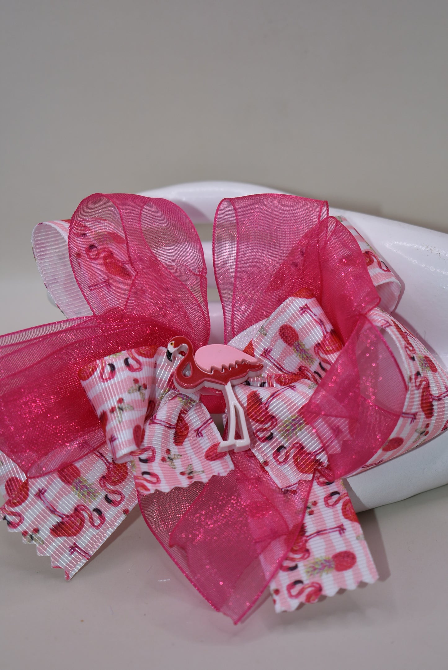 Add a splash of fun with Nana's Collection 104! 🌸 This playful hair clip features a pretty flamingo ribbon in vibrant hot pink, paired with hot pink chiffon that matches perfectly. 🦩 The wrapped alligator clip ensures comfy, easy wear for your little flamingo fans. Perfect for brightening up any day with a touch of tropical charm! 🌺✨