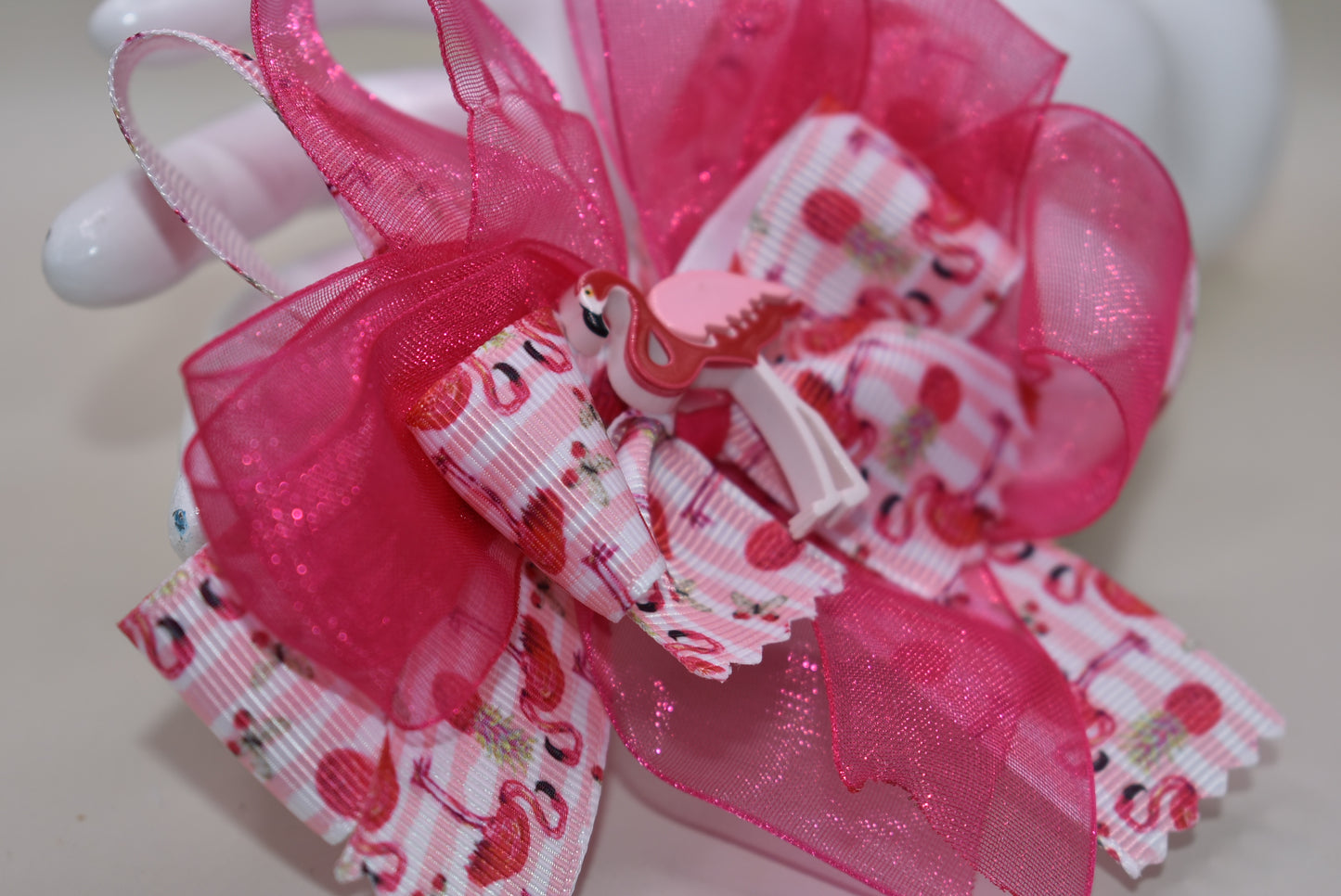 Add a splash of fun with Nana's Collection 104! 🌸 This playful hair clip features a pretty flamingo ribbon in vibrant hot pink, paired with hot pink chiffon that matches perfectly. 🦩 The wrapped alligator clip ensures comfy, easy wear for your little flamingo fans. Perfect for brightening up any day with a touch of tropical charm! 🌺✨