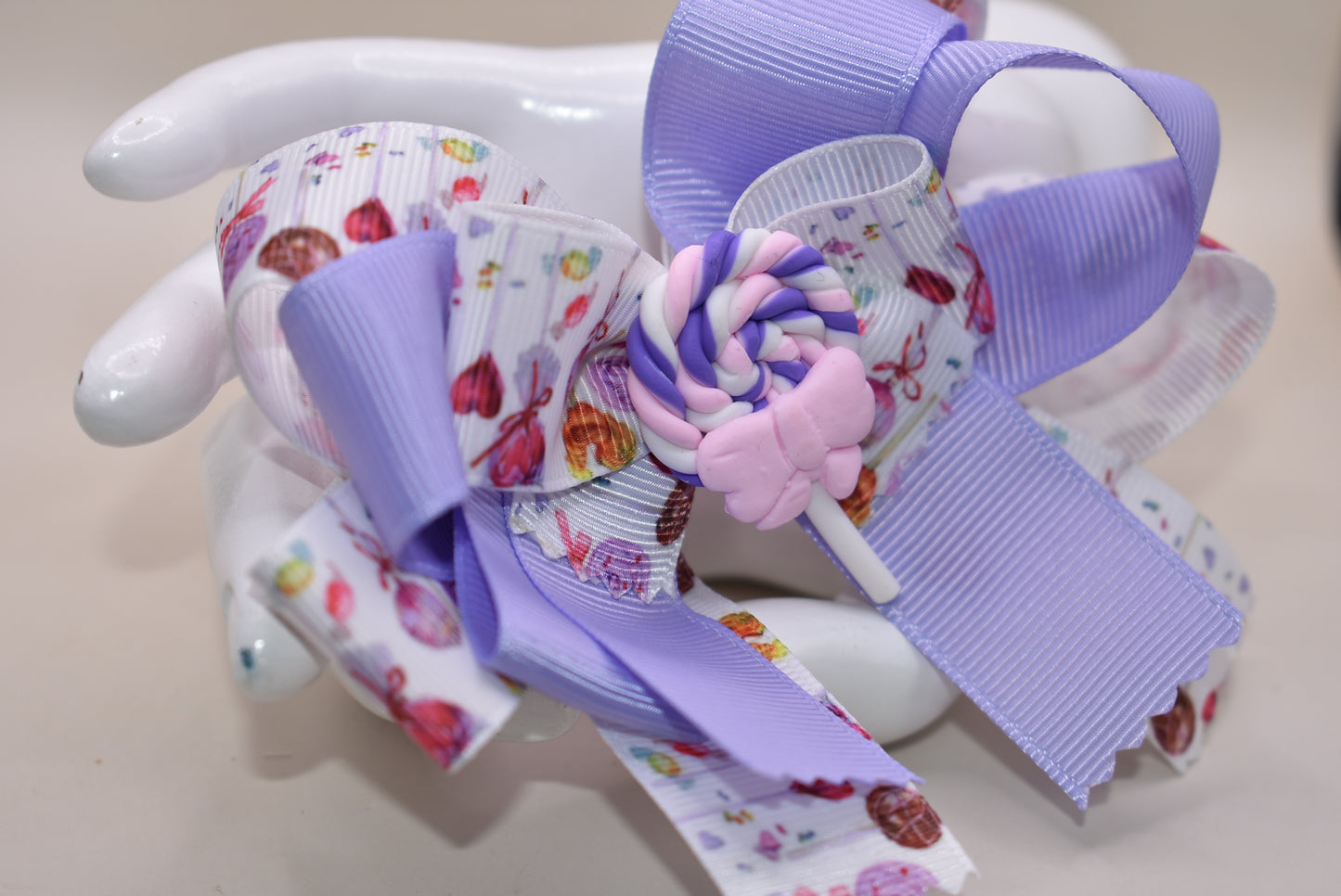 Add a splash of sweetness with Nana's Collection 124! π This adorable lollipop bow blends soft lavender and pink hues, making it impossible not to love. Perfectly playful and charming, itβs secured with a wrapped alligator clip for easy wear. Get ready to brighten any outfit with this cutie! ππ