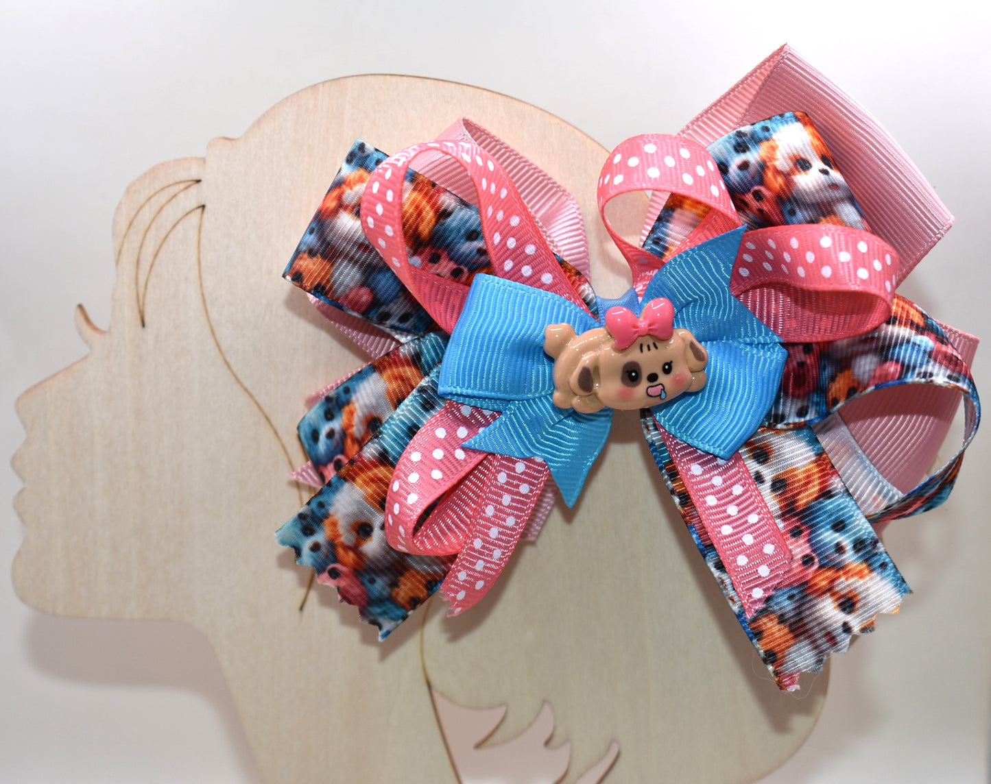 Add a splash of fun with this adorable dog charm from Nana's Collection! Featuring layers of a cute pup and a cheerful polka dot ribbon, it clips on easily with a wrapped alligator clip—perfect for quick, playful style. 🐶🎀 Clip it on and let the smiles begin!