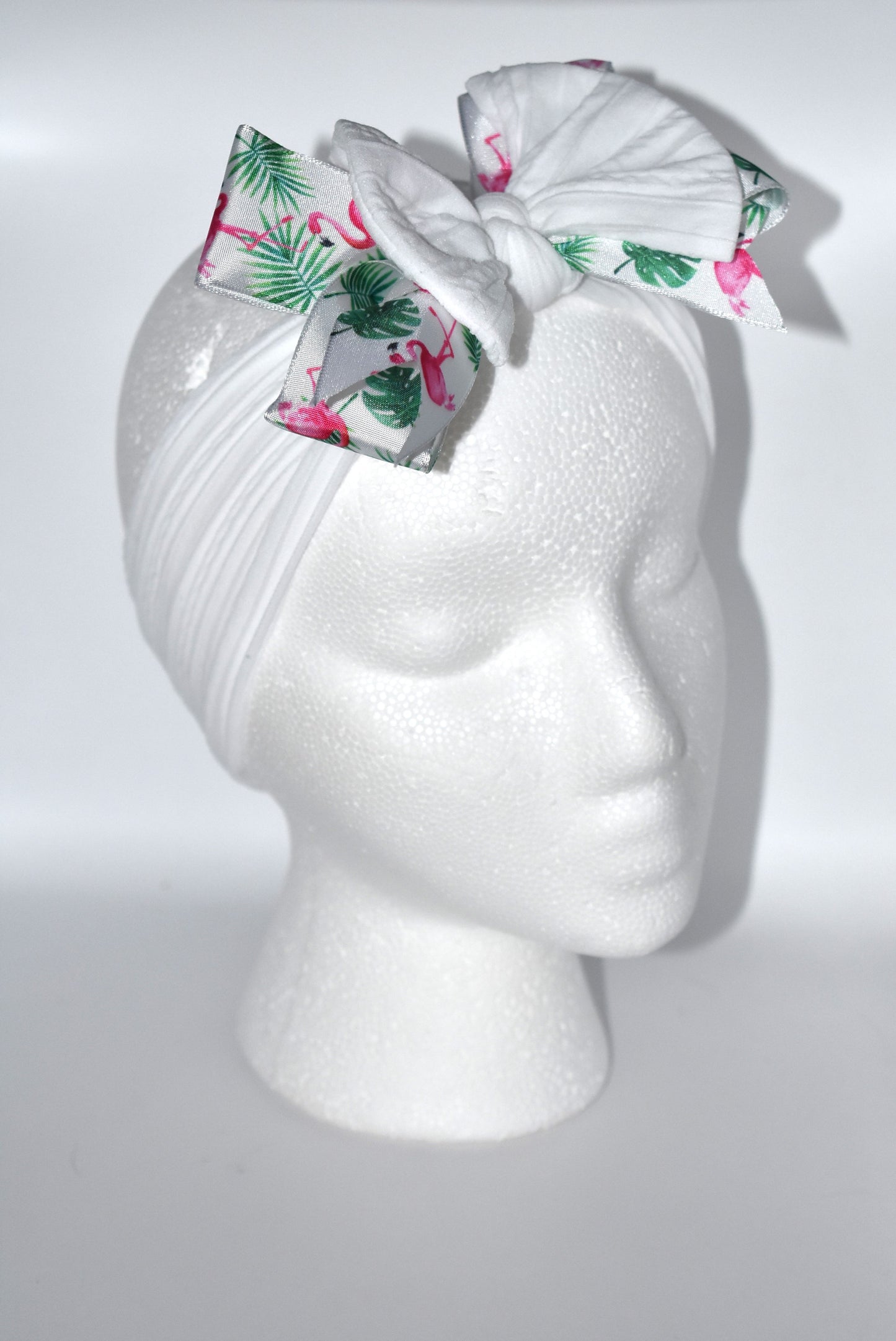 Get ready to flaunt your flamingo flair with this adorable wide white headband! 🎀 Featuring the cutest flamingo ribbon, it’s a one-of-a-kind accessory that adds fun to any outfit. Soft and comfy for all ages, it’s perfect for flamingo fans who love style and comfort! 🦩✨