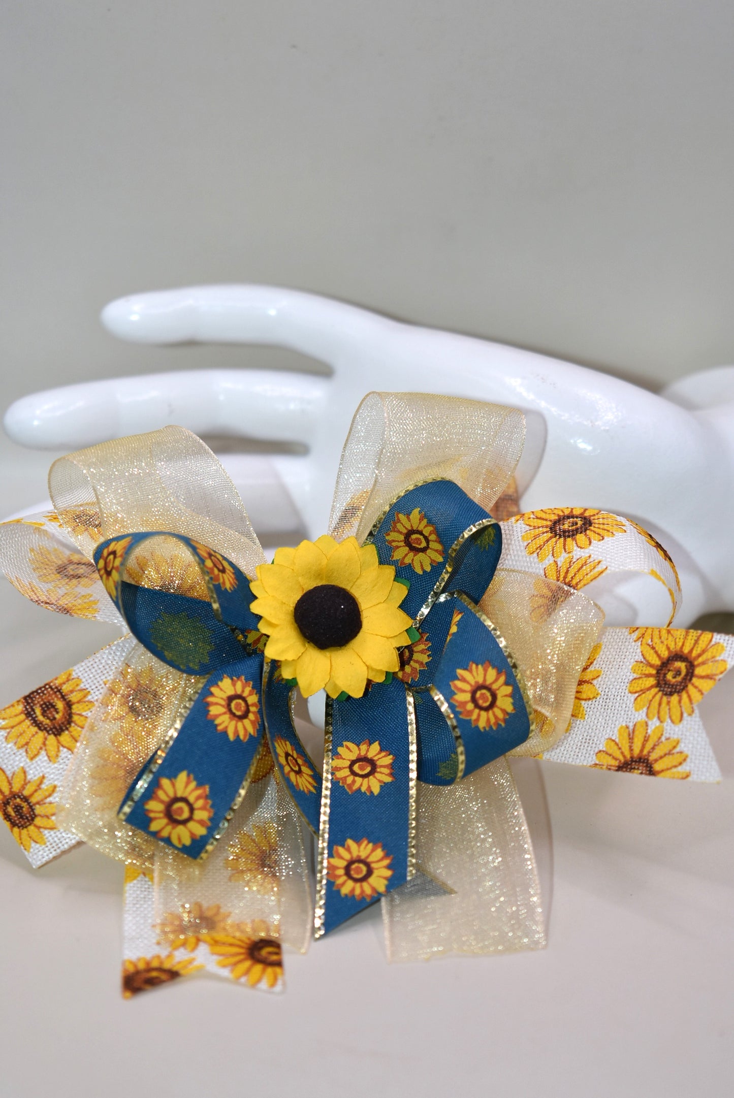 Brighten up your look with Nana's Collection 173! This playful sunflower bow features layers of cheerful sunflowers topped with a pretty floral accent, making it just perfect for fall fun. Securely attached with a wrapped alligator clip, itβs easy to wear and adds a stylish touch to any outfit. ππ»β¨ Let your style bloom this season!