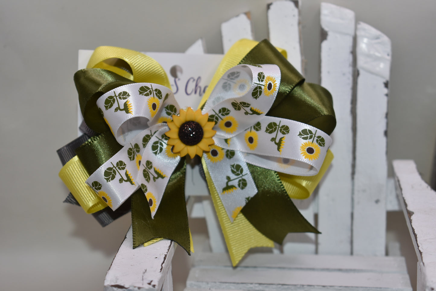Brighten any day with this pretty olive green ribbon hair clip adorned with a super cute sunflower charm 🌻. Featuring layers and layers of lovely ribbon, it wraps comfortably around a secure alligator clip. Perfect for the little sunflower lover who wants to shine with playful style! 🌞