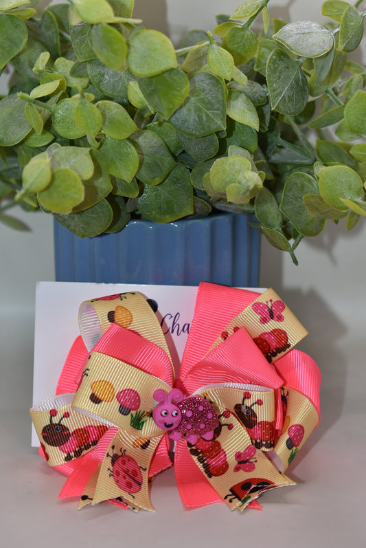 Add a splash of fun with this adorable girly bug-themed ribbon! Featuring a bright pink ribbon accented by the cutest little pink bug perched on top 🐞, this charming clip brings a playful touch to any look. Secured with a wrapped alligator clip on the back, it’s easy to wear for instant cuteness and style 💖. Perfect for brightening your day or gifting to someone special!