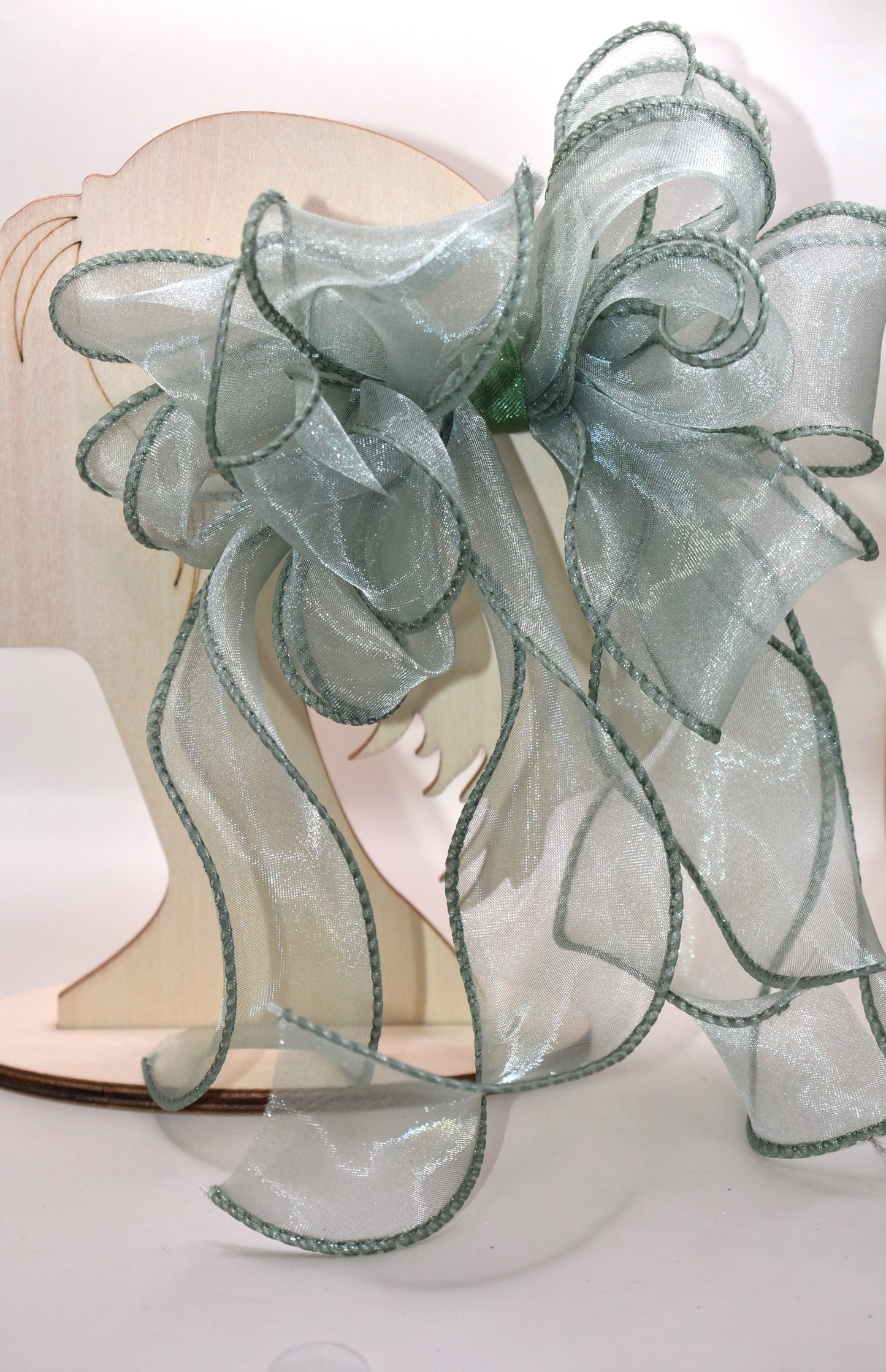 Add a touch of charm with this beautiful sage green long bow, crafted from layers of soft, flowing material. Featuring a wrapped alligator clip, it’s easy to wear and perfect for any age. Whether you’re dressing up or adding a playful twist to your everyday look, this bow brings style and fun wherever you go.