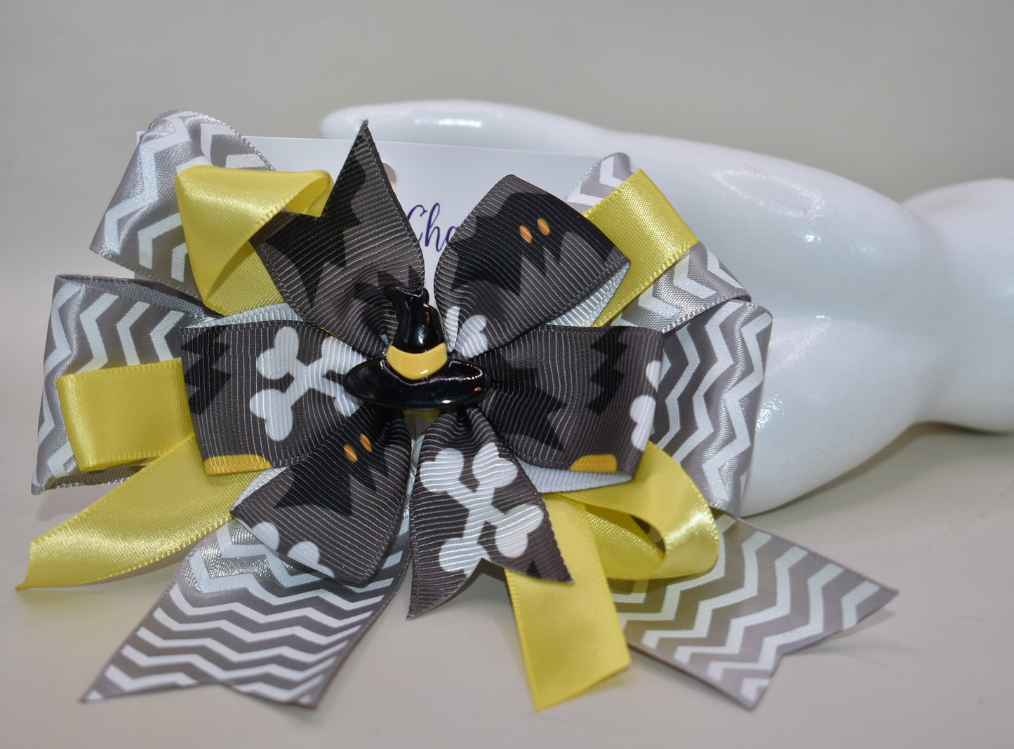 Add a pop of spooky fun with this crazy witches hat π©β¨! Perched atop a swirl of lively yellow and grey ribbons, itβs the perfect playful touch for your Halloween look ππ». The wrapped alligator clip ensures a comfy, secure fit so you can dance through the season with ease. Get ready for trick-or-treating in style! πΈοΈπ€