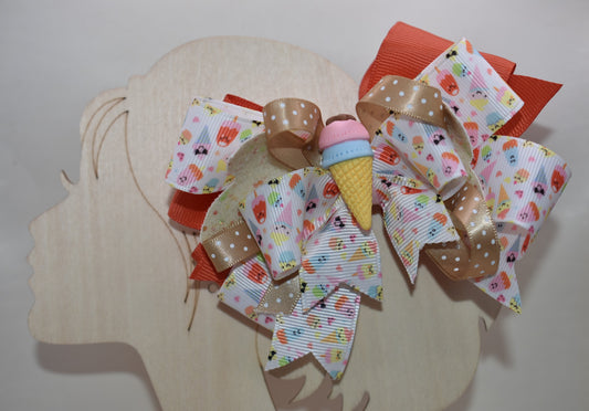 Scoop up the sweetness! 🍦 This delightful bow features layers of fun ice cream ribbon that'll make any hairstyle extra special. ✨ Topped with an adorable ice cream charm, it's the perfect playful accessory for adding a sprinkle of joy to your everyday look. 🎀 Whether you're heading to school, a party, or just want to brighten your day, this charming bow brings the fun wherever you go! 🌈