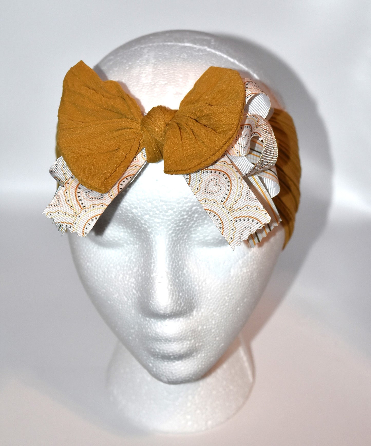 Add a touch of charm with this soft brown headband π featuring layered striped and heart ribbons for a fun, dimensional look. Cozy and comfy, itβs perfect for all ages to wear and play! π