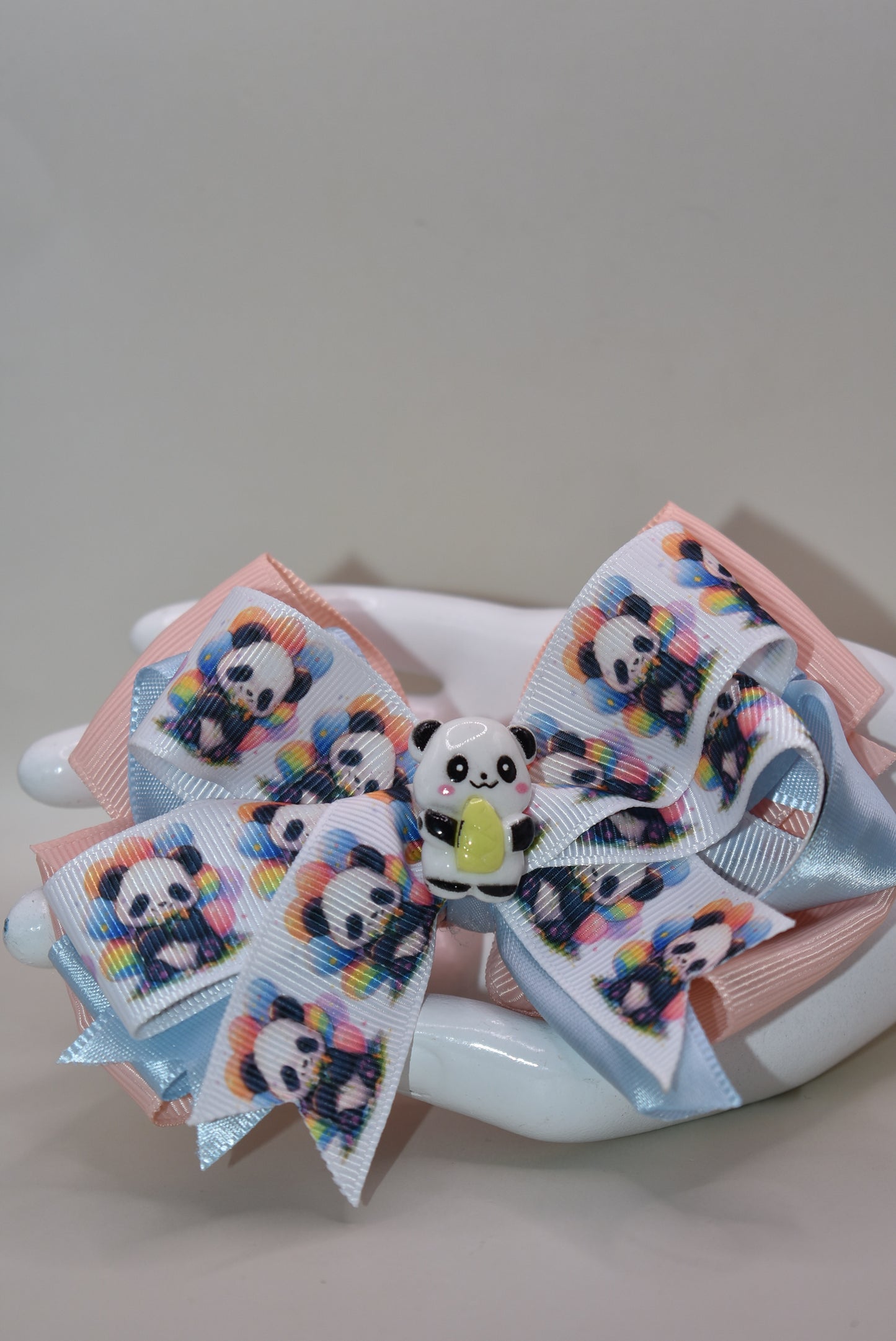 Meet your new favorite accessory! 🐼 This super cute panda bow features an adorable ribbon design with a charming little panda accent that'll have you smiling every time you wear it. The wrapped alligator clip makes styling effortless—just clip and go! ✨ Perfect for adding a playful touch to any hairstyle, this little cutie is impossible not to love. 💕 Get ready to turn heads with this sweet panda charm! 🎀