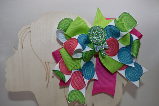 🎀 Add a pop of sweetness to any hairstyle with this adorable multi-colored bow lollipop clip! 🍭 Featuring vibrant hues that complement any outfit, this wrapped alligator clip slides on effortlessly for all-day wear. Perfect for little ones and the young at heart, it's a charming accessory that brings joy and personality to your look. 🌈✨