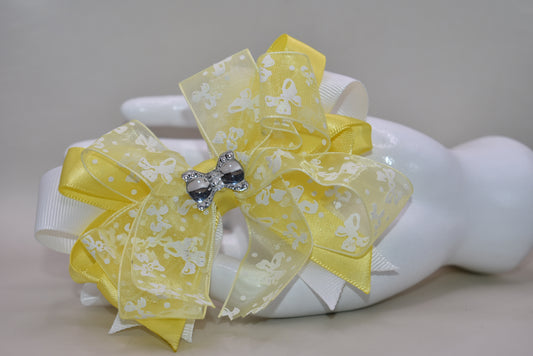 ✨ Introducing Nana's Collection 70 – a sunshine-bright bow that's as charming as it is gorgeous! 🎀 This delightful accessory features layers upon layers of mixed fabric ribbon, creating beautiful texture and dimension. Topped with a delicate bow-themed ribbon and finished with a sparkling crystal bow charm, it's the perfect finishing touch for any look. Whether you're dressing up a hairstyle, gift, or outfit, this cheerful yellow bow brings instant elegance and whimsy. 💛 A little luxury that makes a big i