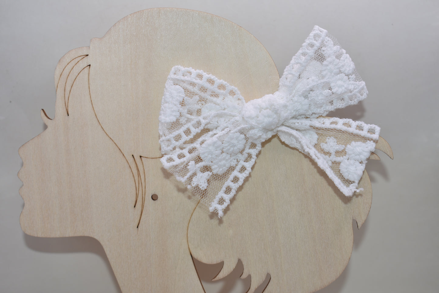 Elevate your style with these charming white lace bows—a delightful duo perfect for adding a touch of elegance to any look. Whether you're styling your hair, accessorizing a gift, or decorating a special occasion, these intricate lace beauties bring sophistication and whimsy in equal measure. Versatile, timeless, and oh-so-lovely, this set of 2 is your go-to for creating picture-perfect moments with effortless grace.