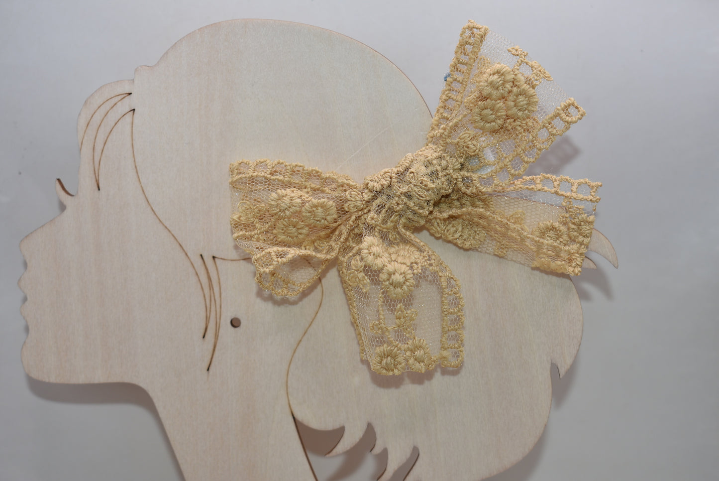 Elevate your accessory game with these stunning gold lace bows! This charming set of two brings instant elegance to any hairstyle, outfit, or creative project. Crafted with delicate lace detailing and a luxe gold finish, they're perfect for adding a touch of sophistication to everyday looks or special occasions. Whether you're styling up for a night out or adding flair to a gift, these versatile bows deliver major charm in a petite package. Double the bows, double the fun!