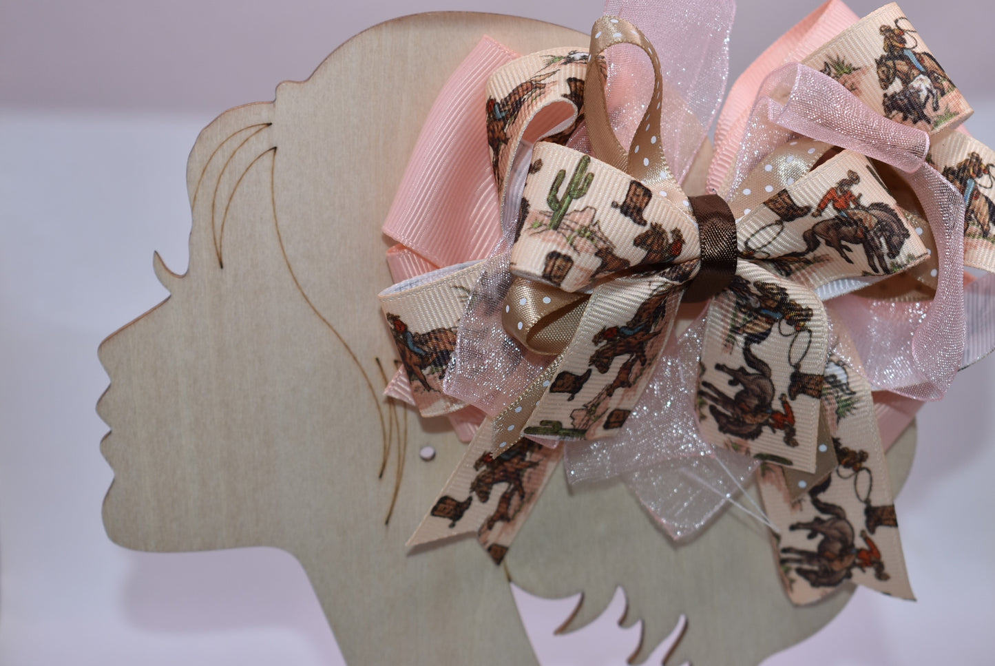 Saddle up for style with this adorable cowgirl bow! 🤠Featuring a vibrant ribbon layer decorated with charming cowgirl motifs, this hair accessory brings Western flair to any look. The secure alligator clip backing keeps your hair in place all day long, whether you're heading to the rodeo or just channeling your inner cowgirl. 🎀 Perfect for adding a playful touch to braids, ponytails, or half-up styles. Yeehaw! 🌟