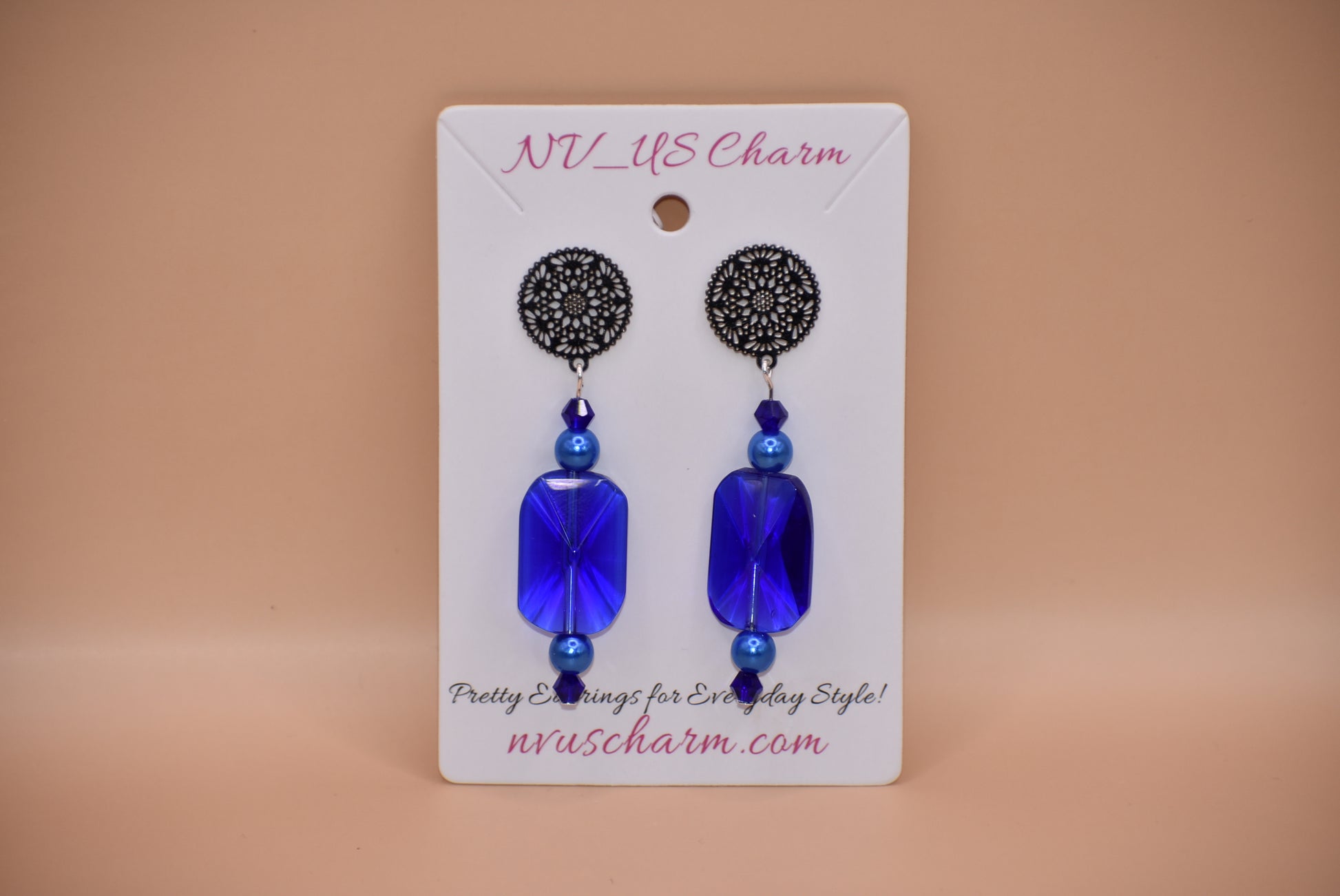 The Blue Collection 19 is perfect for any occasion. Its stunning cobalt blue crystals and blue pearls, set in silver filigree posts, offer a timeless and comfortable elegant look. Wear it and make a statement.