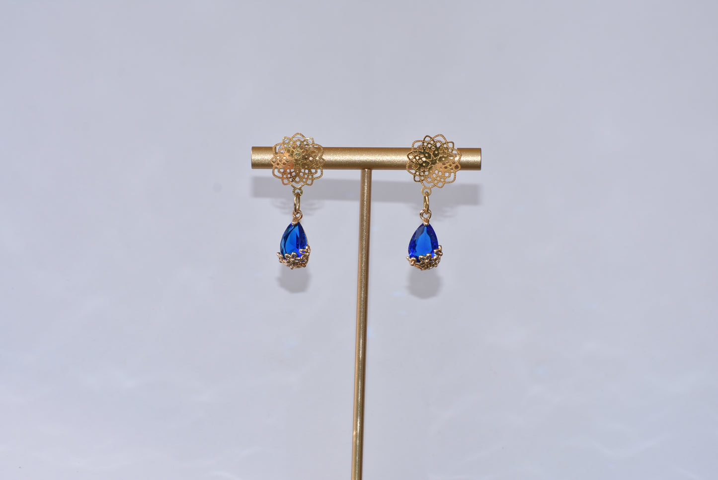 Our exquisite Blue Collection features beautiful gold filled filigree posts with a stunning blue gemstone held within a sophisticated gold filigree flower. A truly stunning piece of jewelry that will not go unnoticed.