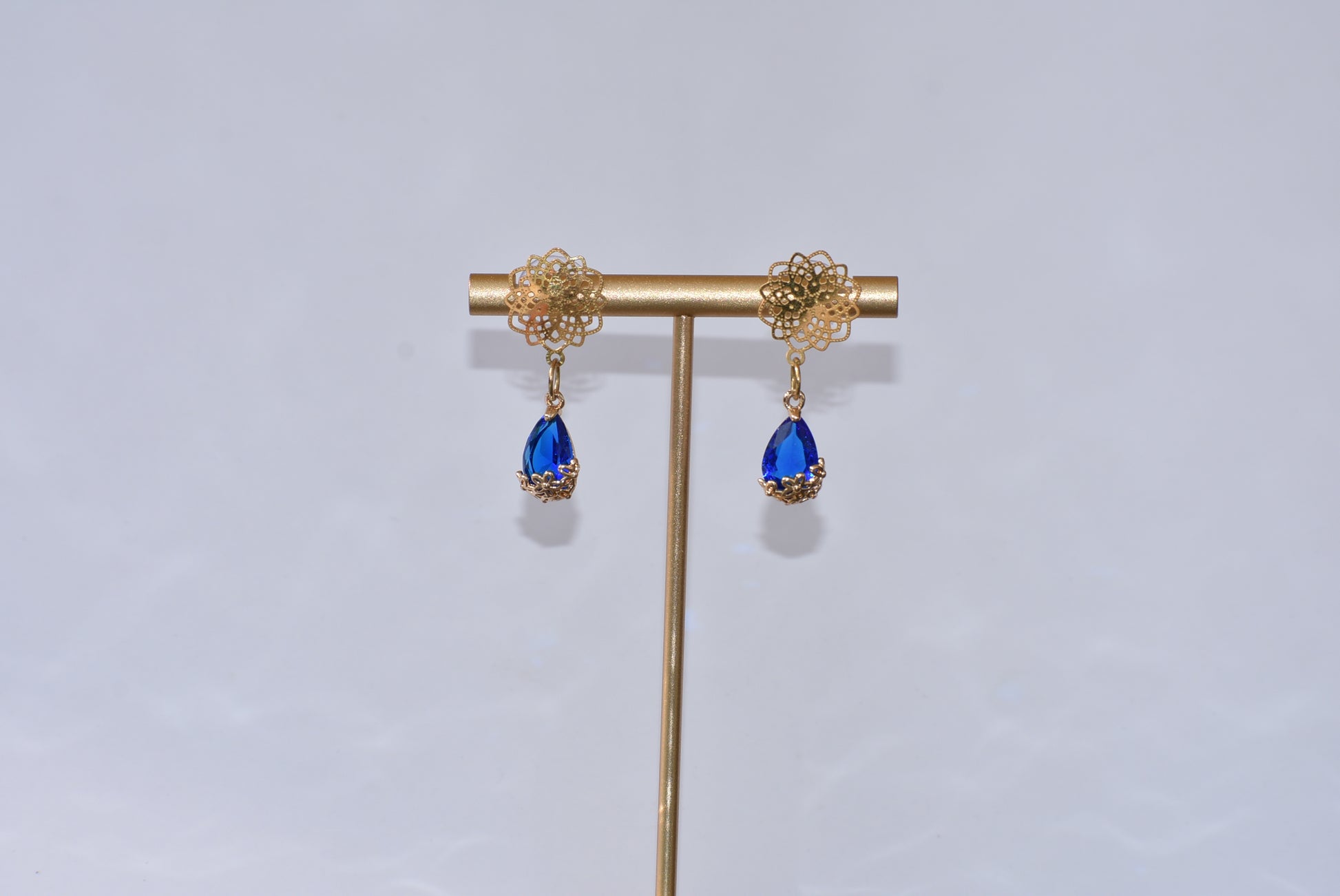 Our exquisite Blue Collection features beautiful gold filled filigree posts with a stunning blue gemstone held within a sophisticated gold filigree flower. A truly stunning piece of jewelry that will not go unnoticed.