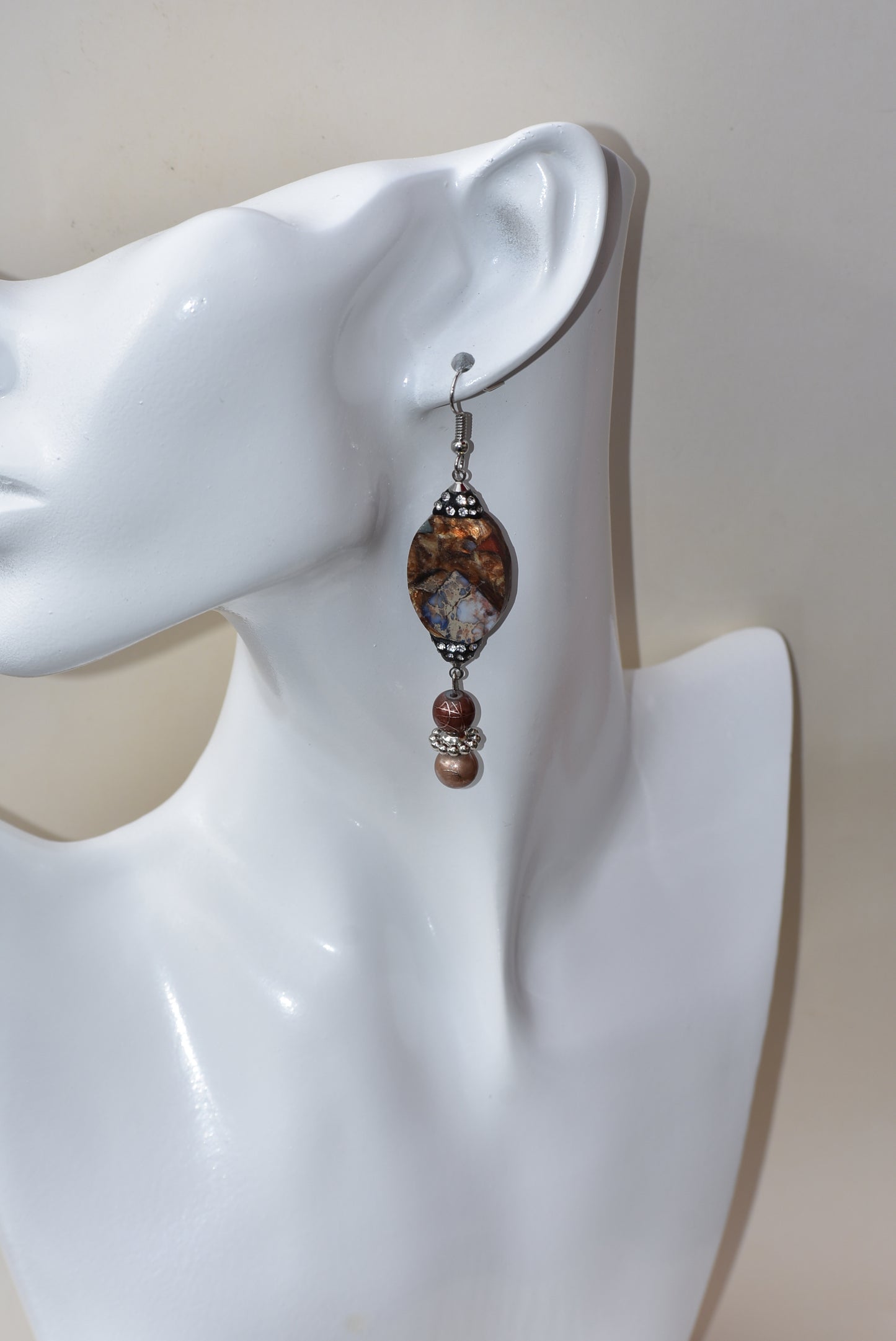 These silver hanging earrings have many different shades of brown to compliment your outfit. They hang on the long side but are comfortable for everyday wear. 