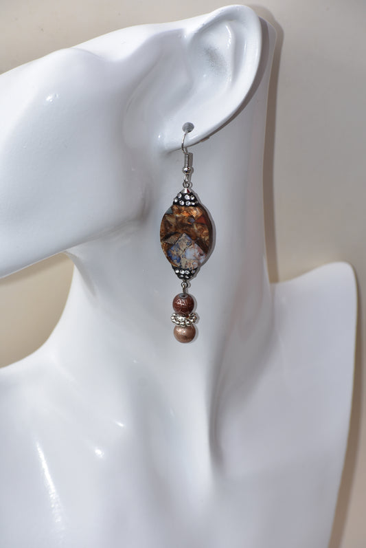 These silver hanging earrings have many different shades of brown to compliment your outfit. They hang on the long side but are comfortable for everyday wear. 