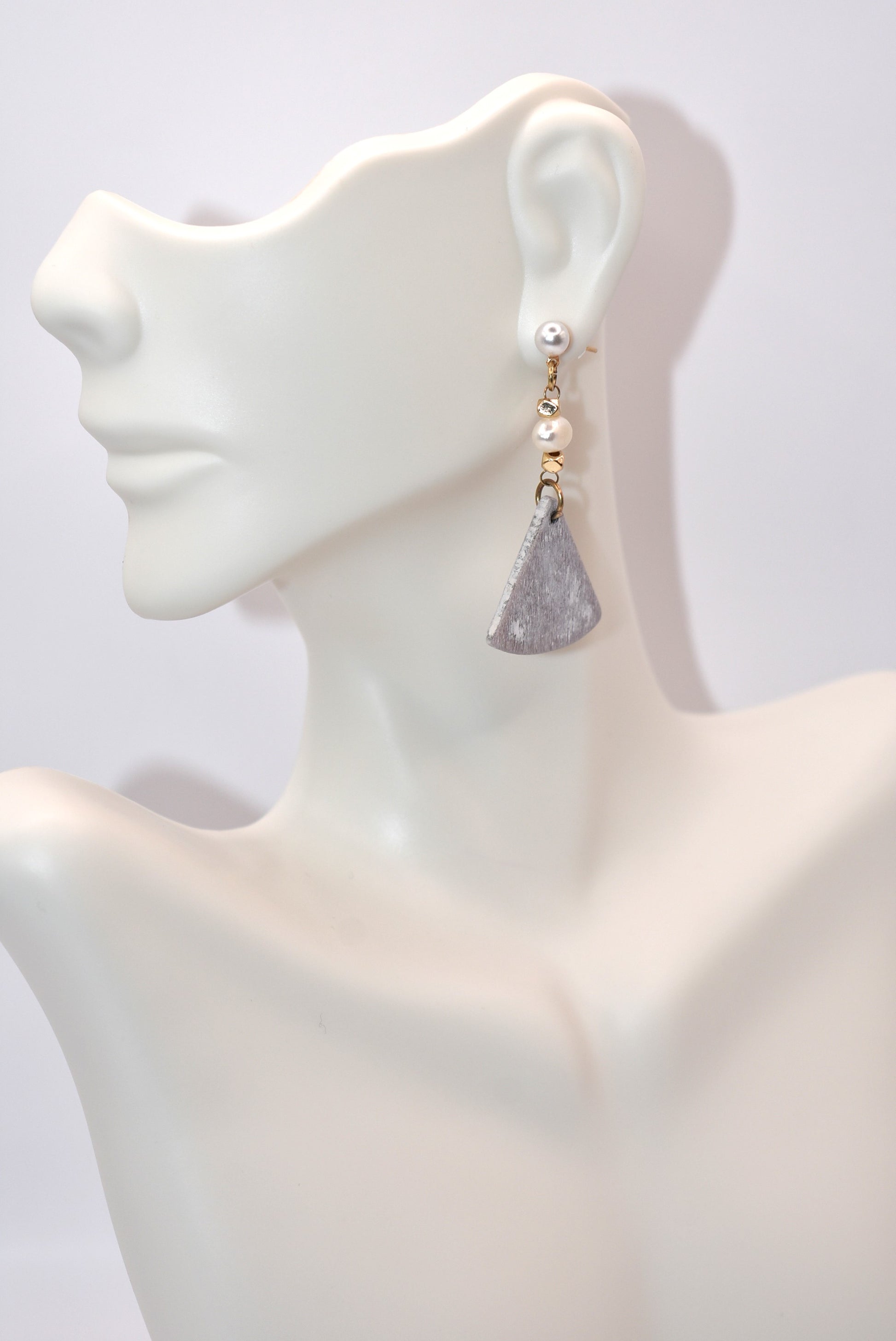 Introducing the playful Gray Collection! These beautiful stainless steel pearl posts hang comfortably on your ear, adding a stylish and lightweight touch to any outfit. Less than 2 inches, these earrings are super comfortable for all day wear.