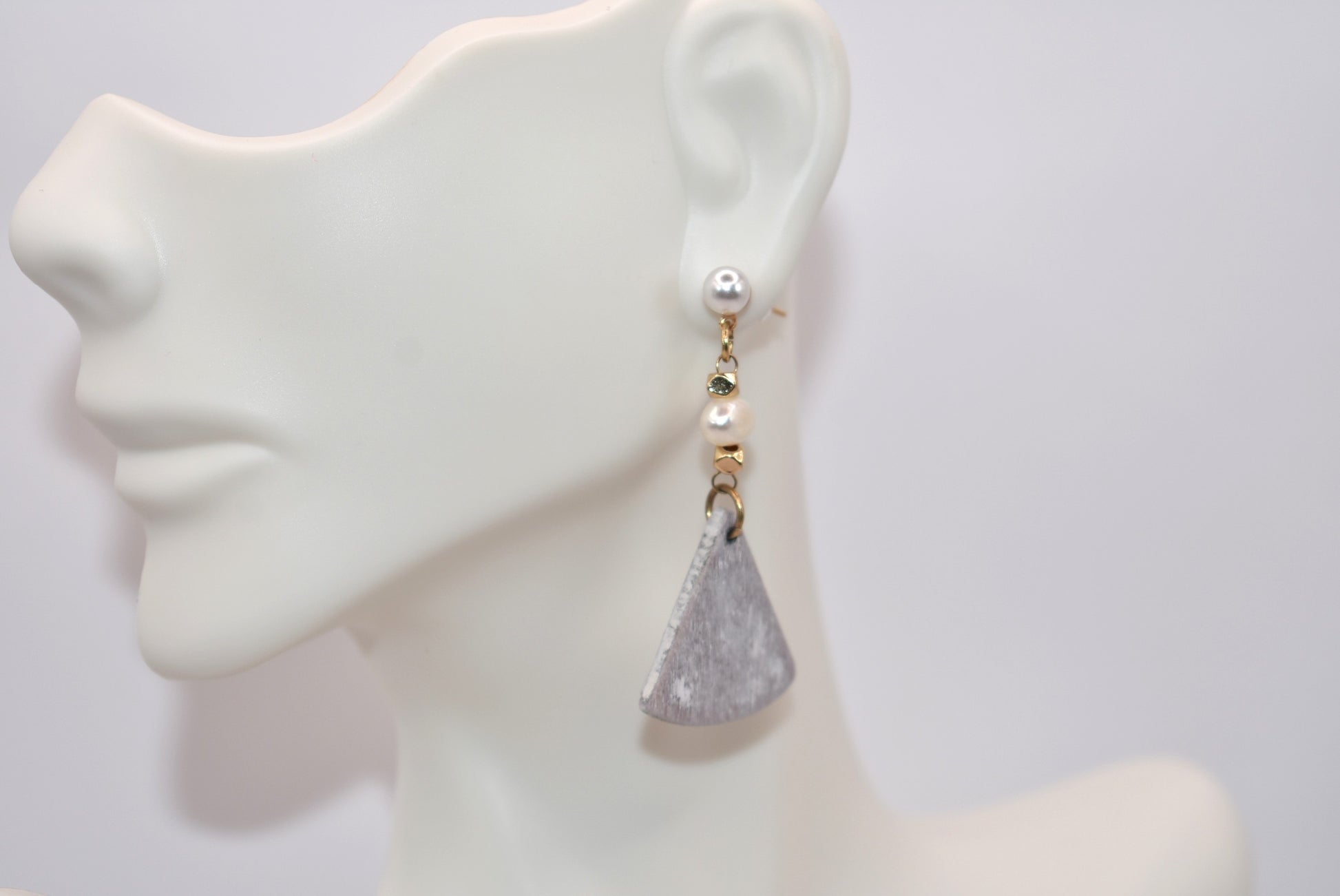 Introducing the playful Gray Collection! These beautiful stainless steel pearl posts hang comfortably on your ear, adding a stylish and lightweight touch to any outfit. Less than 2 inches, these earrings are super comfortable for all day wear.