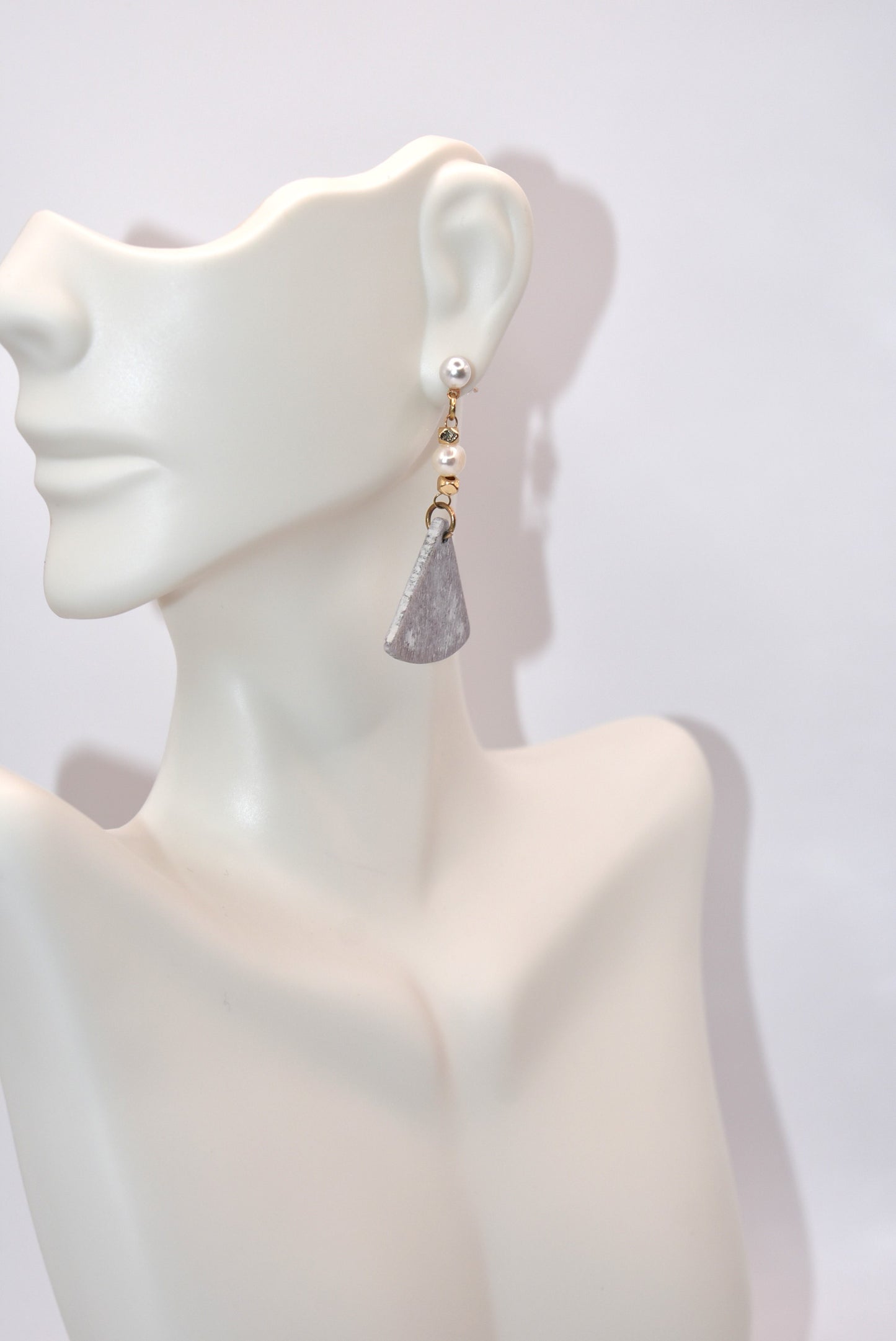 Introducing the playful Gray Collection! These beautiful stainless steel pearl posts hang comfortably on your ear, adding a stylish and lightweight touch to any outfit. Less than 2 inches, these earrings are super comfortable for all day wear.