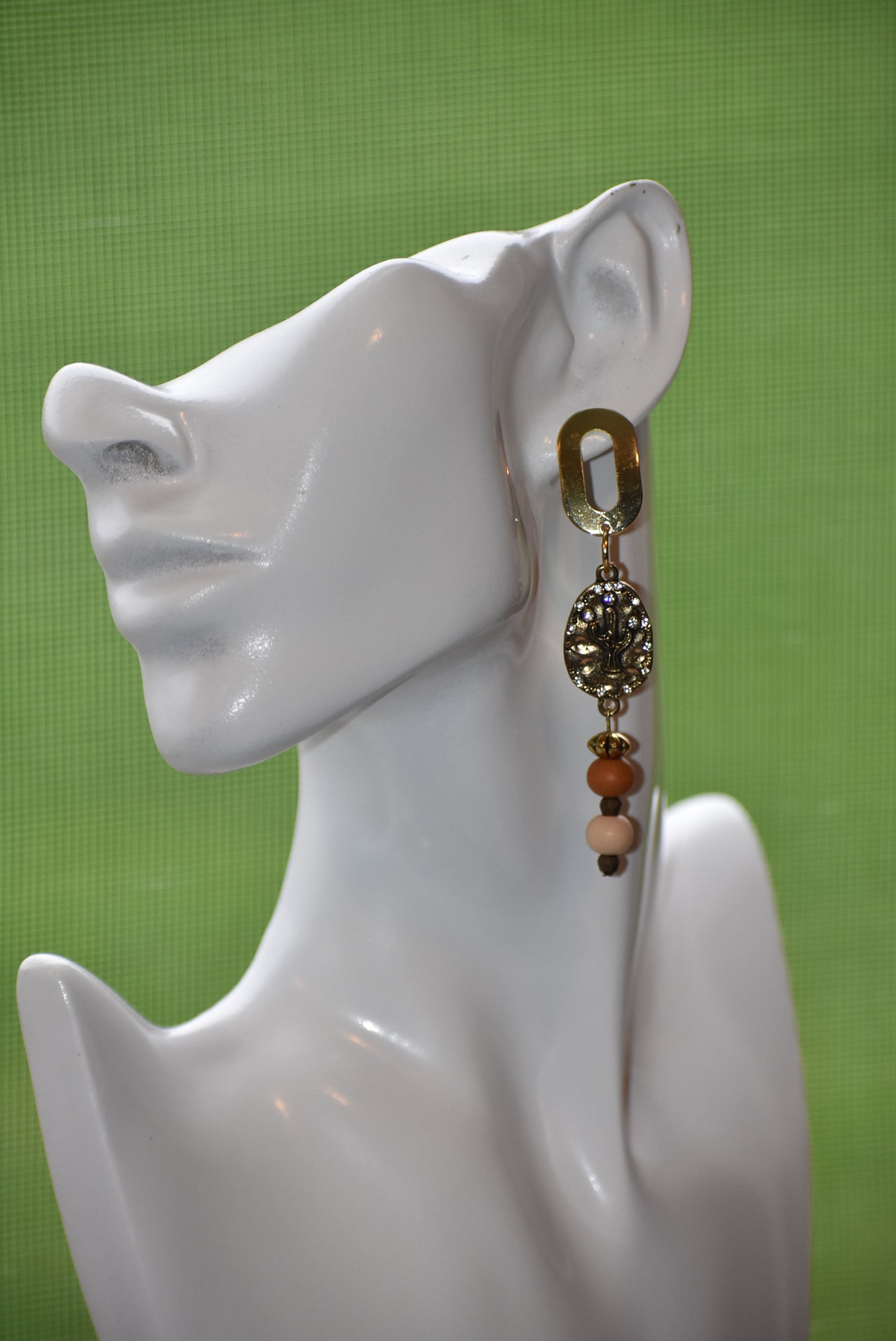 Don these wild West inspired earrings and make a fashion statement worth yodeling about! The open oblong silver posts sweetly support a cactus and crystal charm accompanied by multi-colored wood beads. Comfortable and lightweight, they hang on the long side, but will fill your ears with an unforgettable style. Whoa, Cowboy!