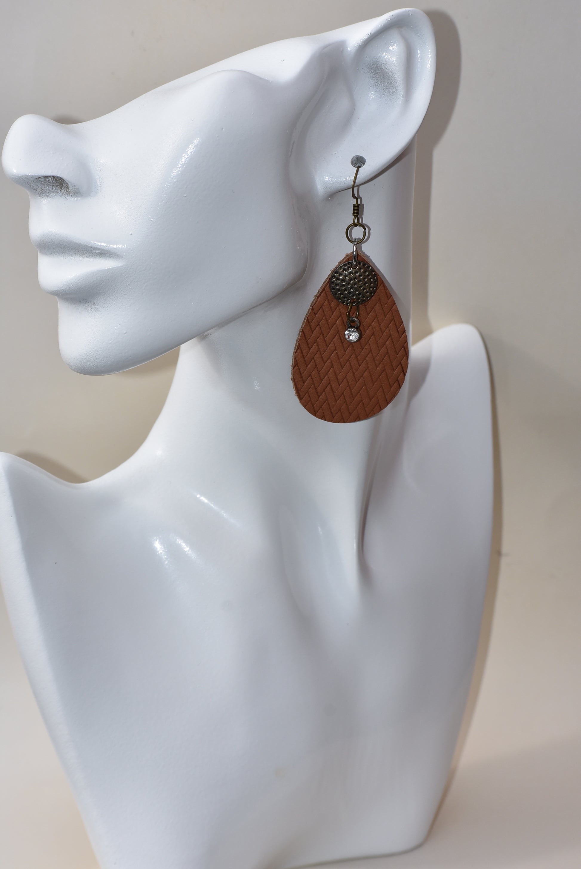 These brown teardrop earrings are so comfortable and easy to wear every day.  Set with a bronze hanging hook for an extra touch of color.