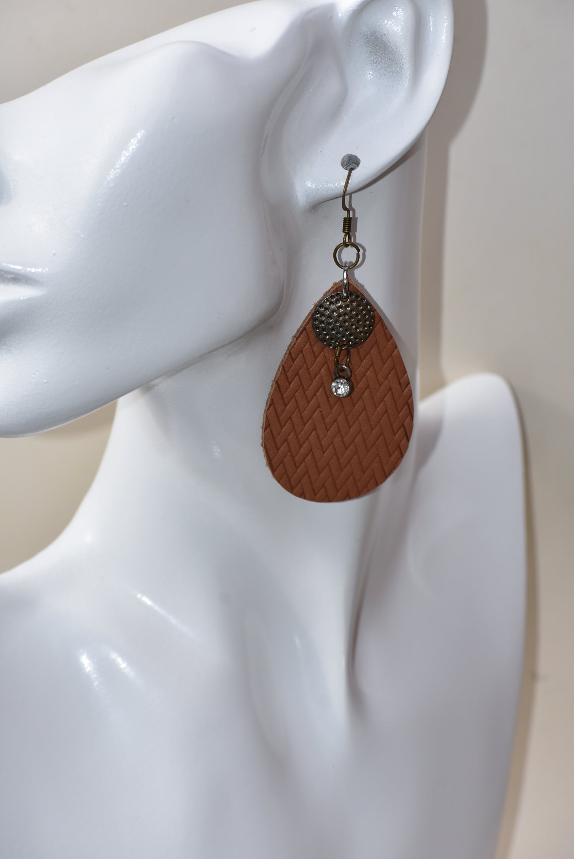 These brown teardrop earrings are so comfortable and easy to wear every day.  Set with a bronze hanging hook for an extra touch of color.