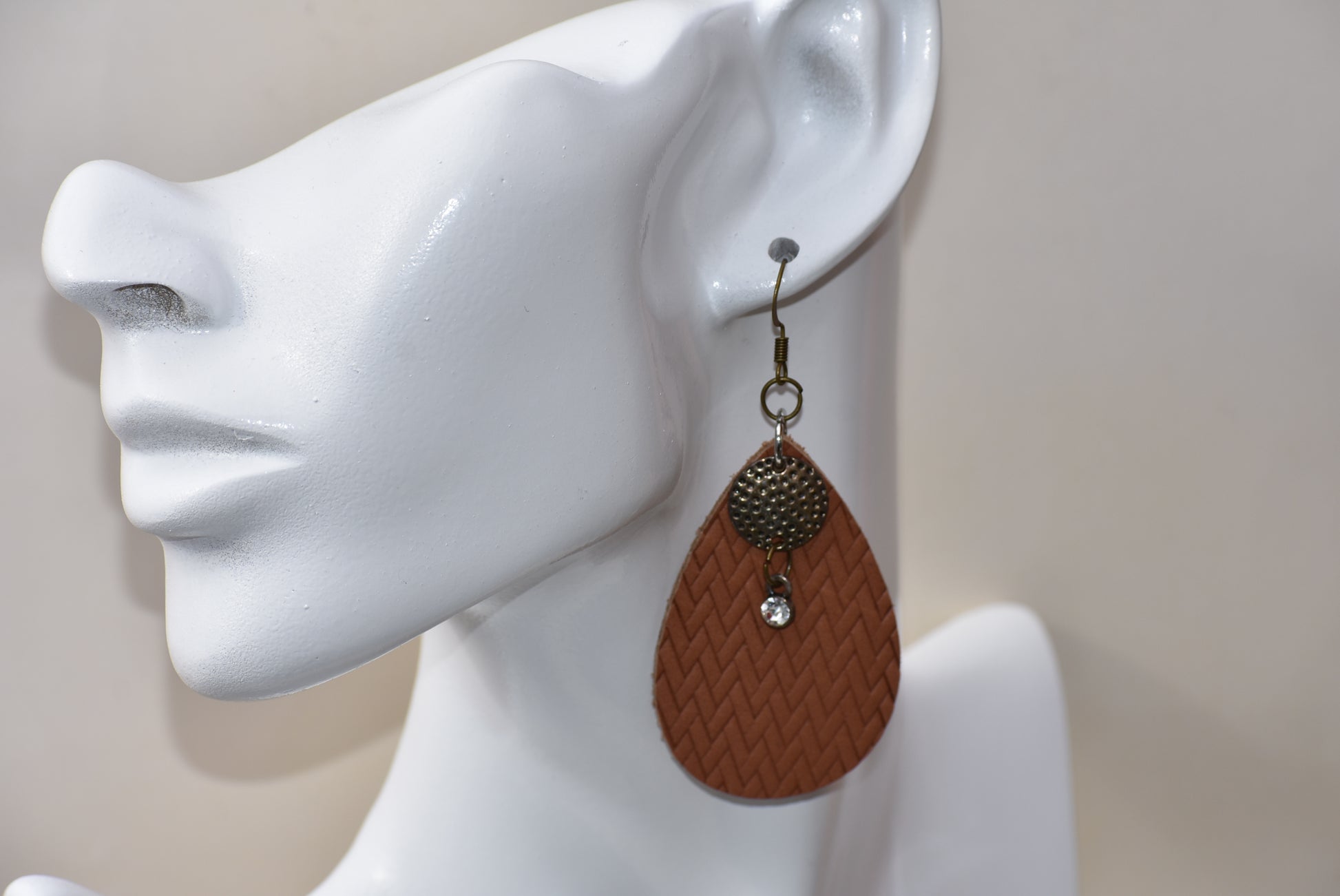 These brown teardrop earrings are so comfortable and easy to wear every day.  Set with a bronze hanging hook for an extra touch of color.