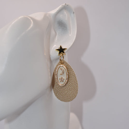 ✨ Dare to be different with our Gold Collection! These gold filled earrings feature faux leather teardrops with a shimmering touch, holding a charming half-moon and star. Add a unique and playful touch to any outfit with our quirky and fun design. 🌙⭐ Prefect for something a little extra!