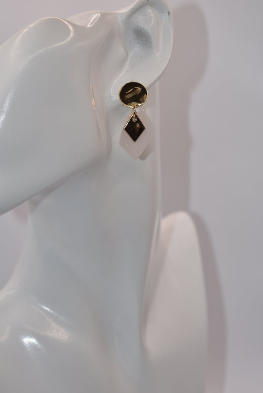 Get ready to shine with our Gold Collection! These super cute and stylish earrings feature hypoallergenic round posts and a small faux leather teardrop with a pretty gold charm on top. Say goodbye to irritation and hello to fashion with our gold collection.