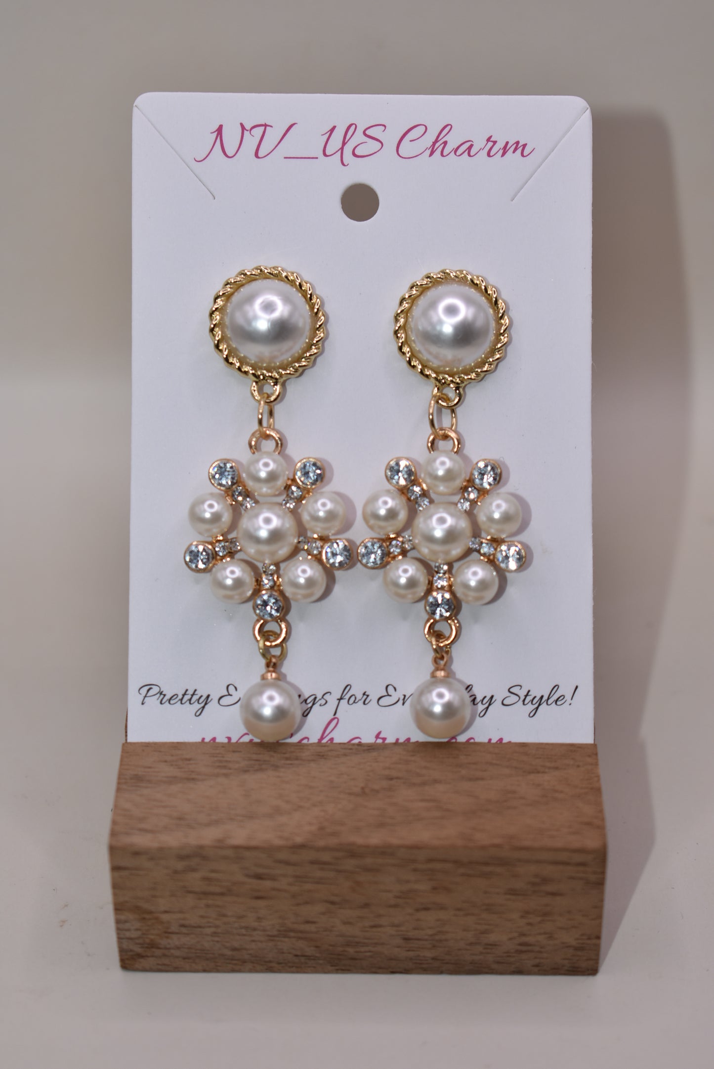 This stunning Wedding Collection features a picture perfect design perfect for any bride. Each beautiful pearl post holds an elegant pearl cluster with gem stones and is finished off with a hanging pearl at the bottom, making the perfect statement for a special day.