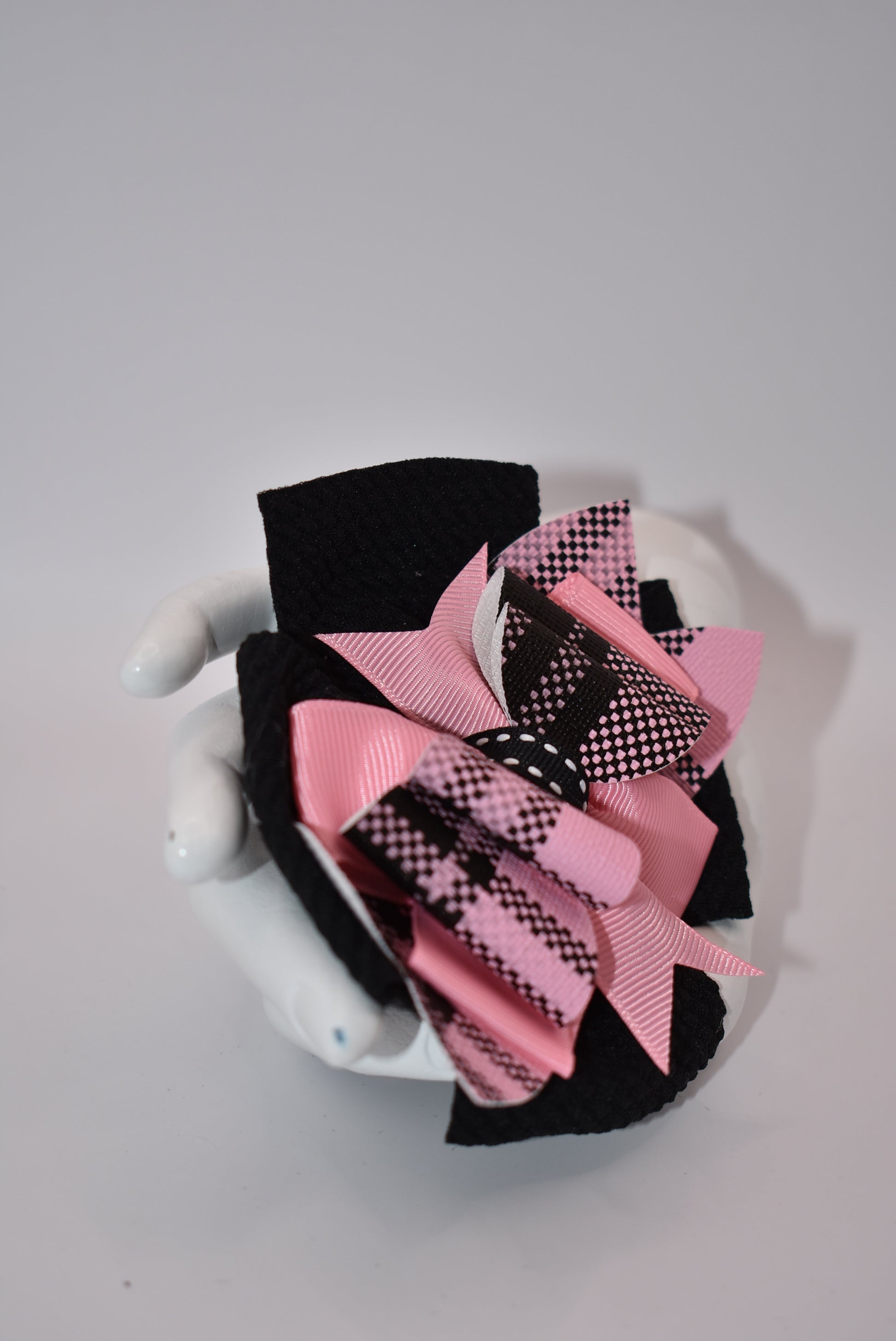 Add a pop of color to your little girl's outfits with Nana's Collection! The beautiful pink and black combination is sure to make her stand out. Plus, the alligator clip makes it easy to wear. This one-of-a-kind bow is perfect for your unique little one!