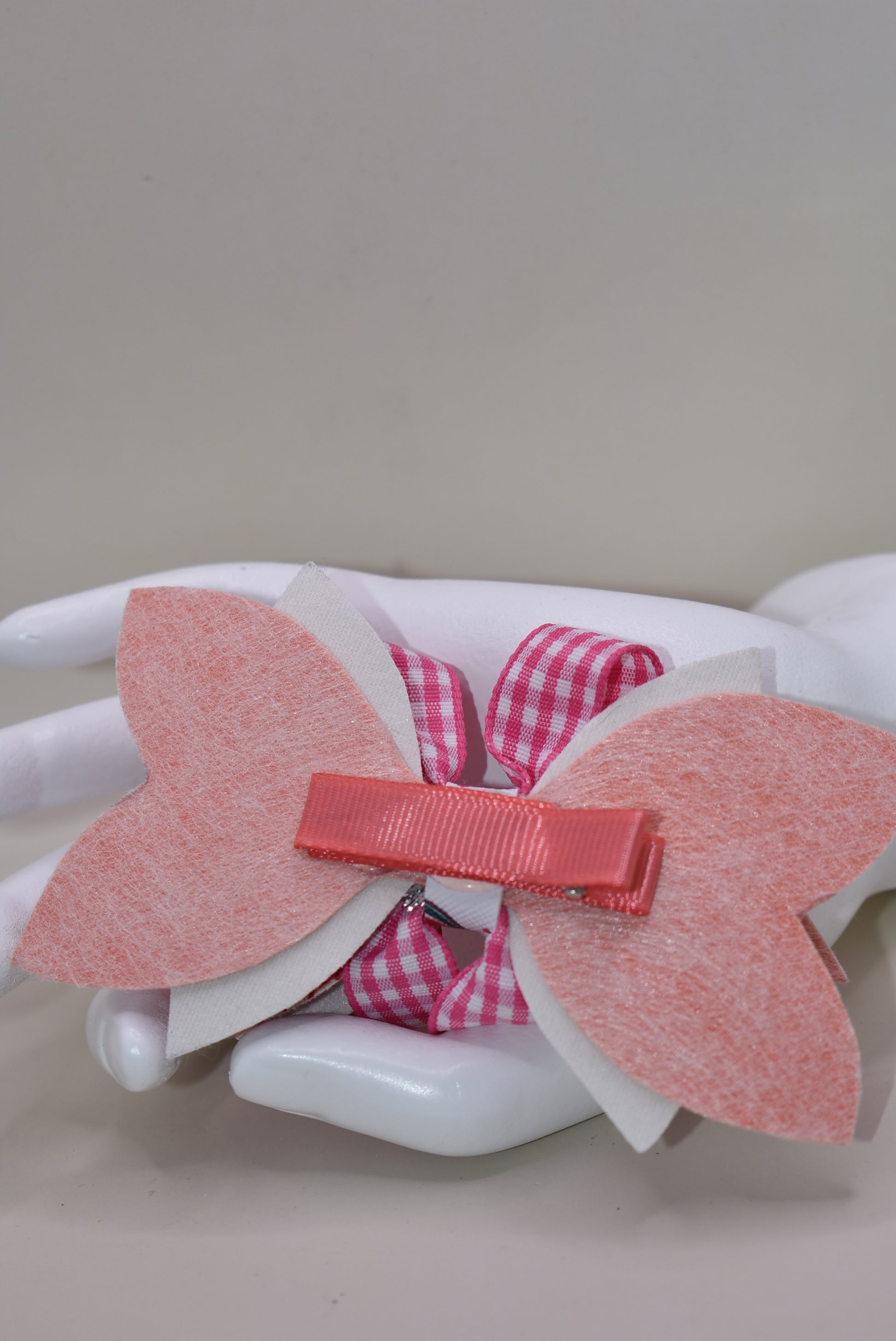 Introducing The Bow Corner! This adorable watermelon designed faux leather bow with a unique pink checkered accent is the perfect summer accessory for your little one. Its covered alligator clip makes for easy styling, while the playful pink and white colors add a fun touch to any outfit. Get ready to wow with this playful and stylish bow!