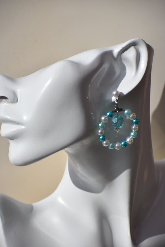 Aqua and off-white pearls combine so perfectly together with a pretty aqua crystal hanging in the middle.  These earrings look so pretty on the ear thanks to the pretty pearl post holding it all together.  This is a one-of-a-kind piece.  