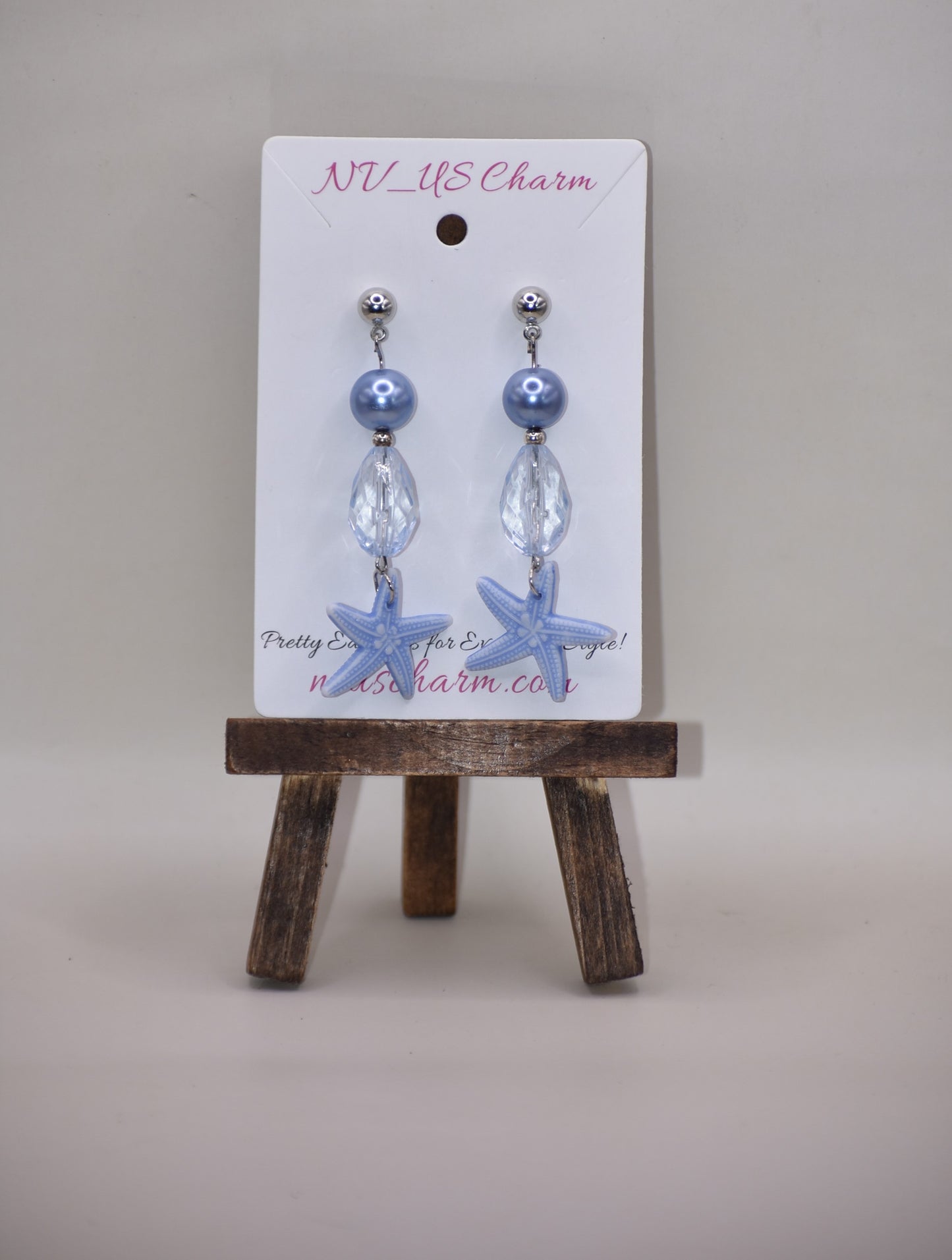 ⚓️ Add a touch of nautical elegance to your wardrobe with our Nautical Collection! These stunning blue pearl, crystal and starfish earrings are held securely by silver hypoallergenic posts. Lightweight and comfortable, they hang 2" off the ear. Perfect for any occasion!