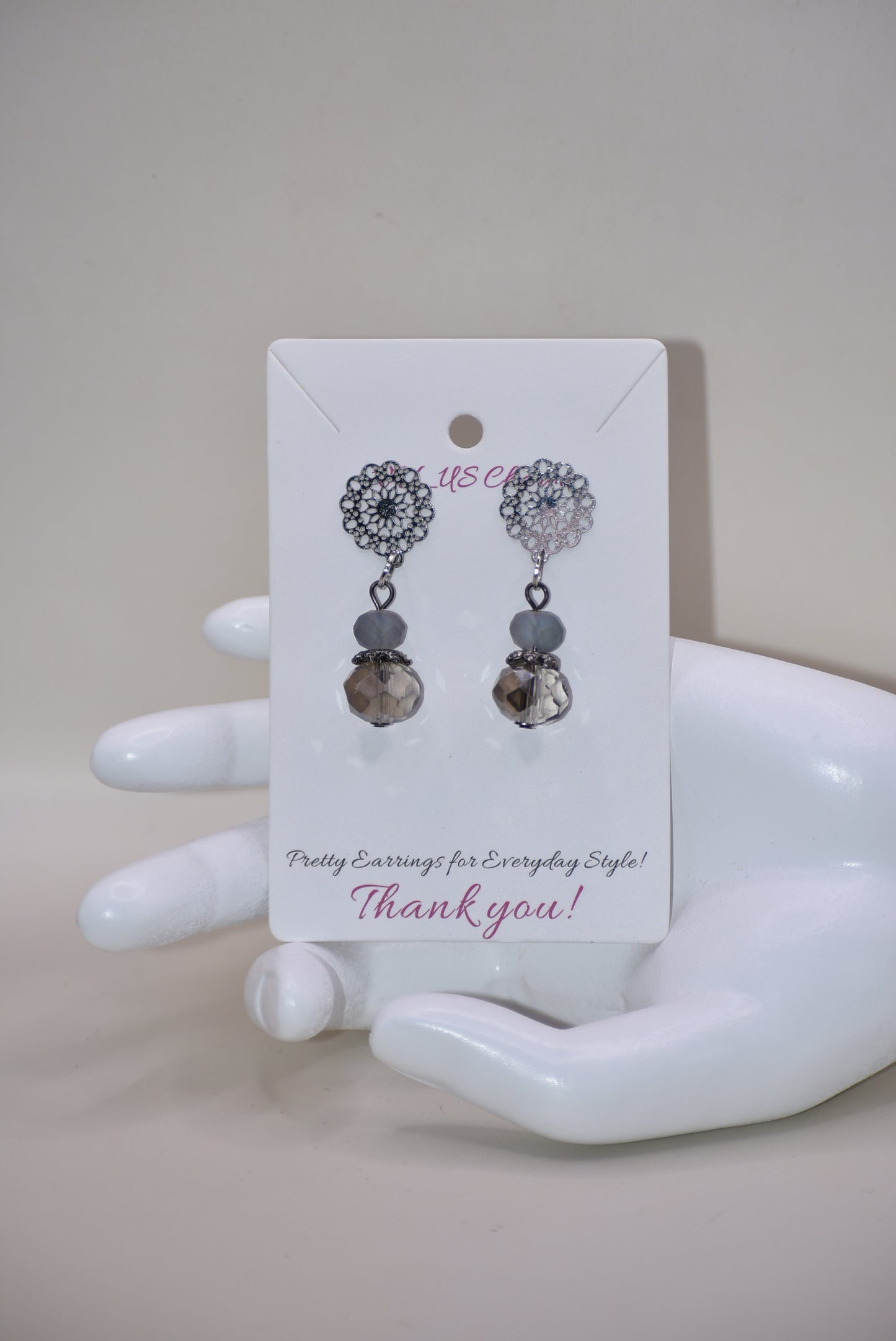 The Gray Collection 5 features filigree posts adorned with grey crystals and beads, perfect for everyday elegance. High-quality materials and intricate designs ensure a stylish and durable product, while classic hues add timeless beauty to any look.