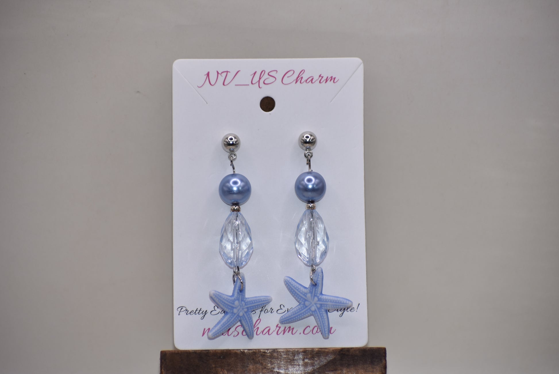 ⚓️ Add a touch of nautical elegance to your wardrobe with our Nautical Collection! These stunning blue pearl, crystal and starfish earrings are held securely by silver hypoallergenic posts. Lightweight and comfortable, they hang 2" off the ear. Perfect for any occasion!