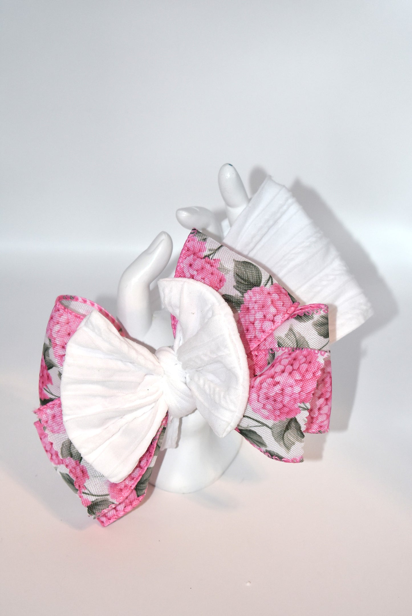 Add a pop of charm with this Wrapped Headband Collection 3! 🌸 Featuring a playful bow on top and a stunning pink flower ribbon beneath, it's the perfect accessory to catch those admiring glances. Comfortable and unique, this wide headband is your go-to for effortless style and a little touch of fun! 🎀✨