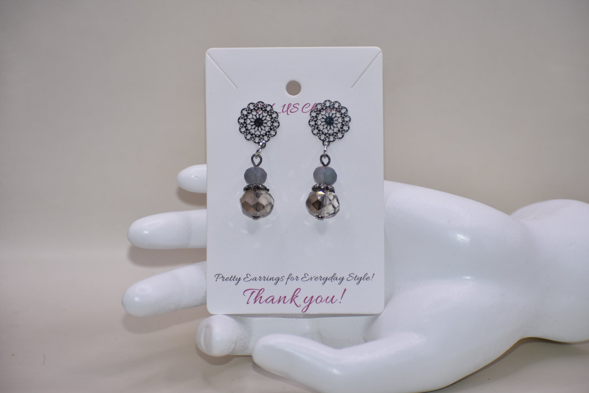 The Gray Collection 5 features filigree posts adorned with grey crystals and beads, perfect for everyday elegance. High-quality materials and intricate designs ensure a stylish and durable product, while classic hues add timeless beauty to any look.