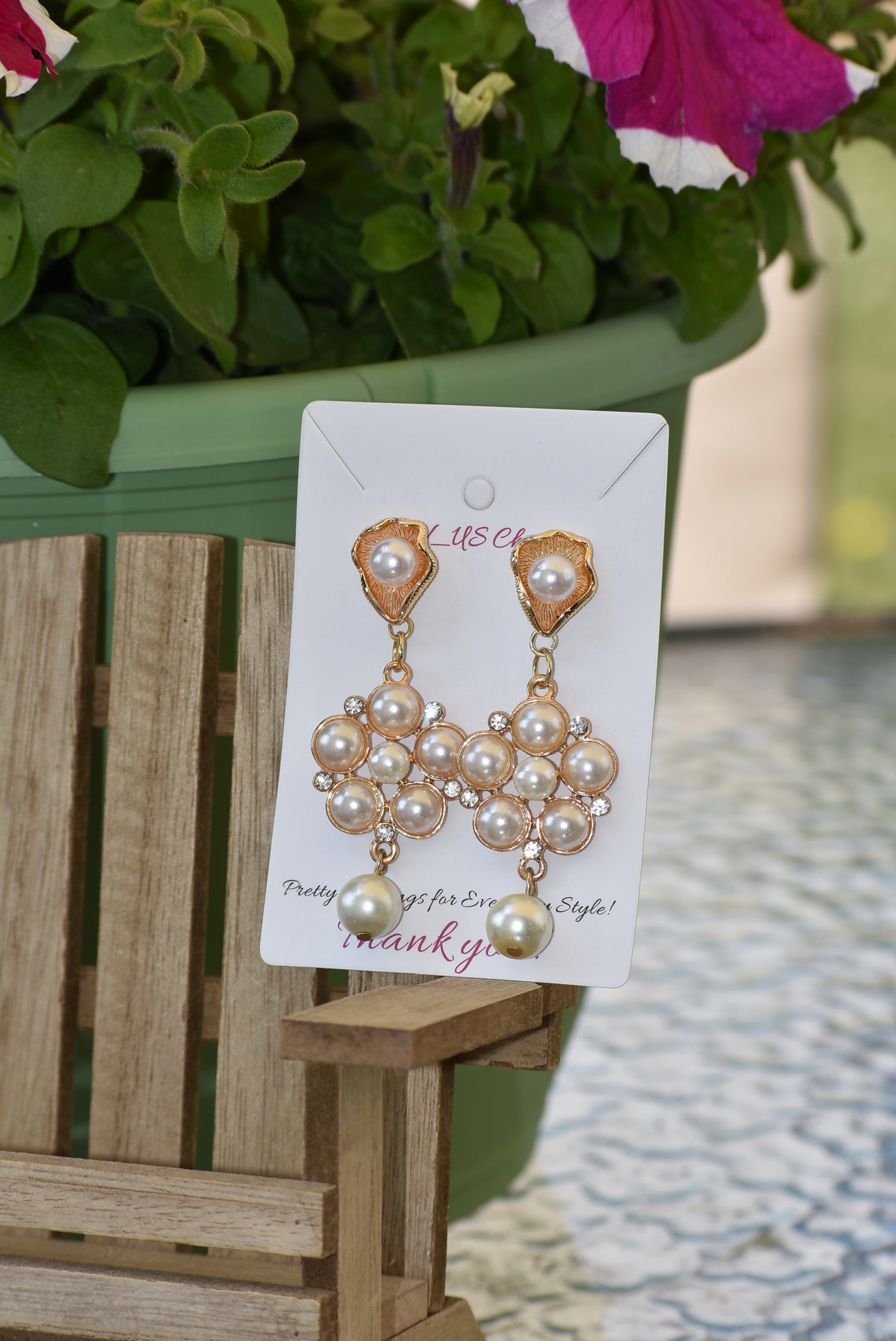 This luxurious Wedding Collection 13 features prestigious posts crafted from pearl and gold that hold a stunning cluster of pearls and crystals. A single suspended pearl adds an elegant finishing touch. Perfect for special occasions or any time you want to make a statement.