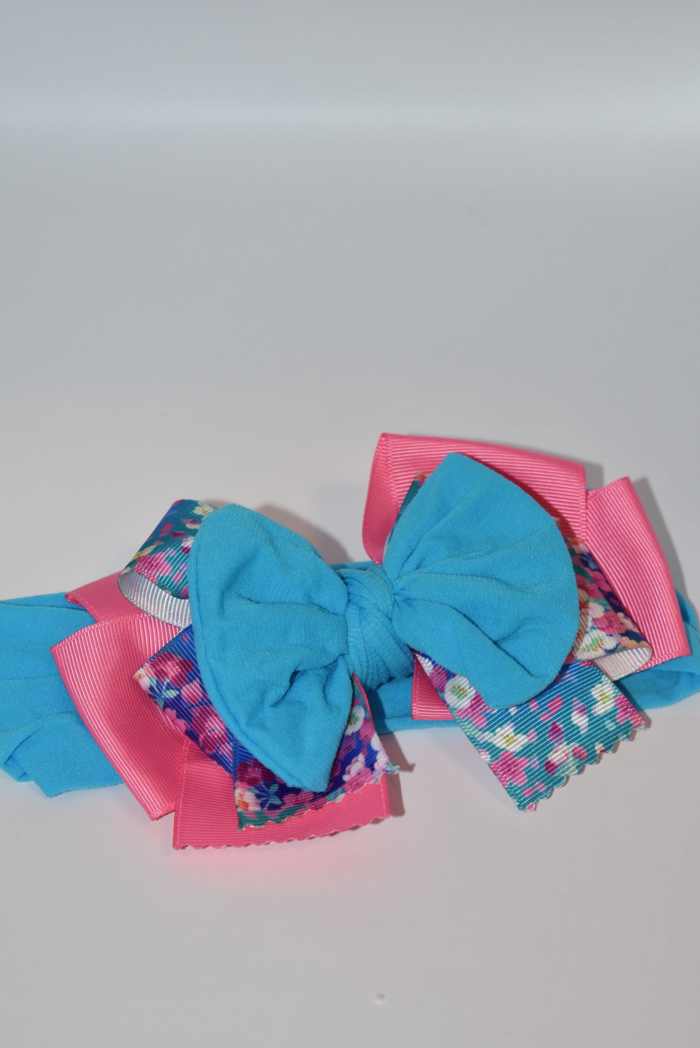 Add a splash of fun to your look with this Wrapped Headband from our Collection 4! 🎀 Featuring soft pink and blue hues and a charming flower motif 🌸, it’s perfect for anyone who loves a cheerful pop of color. One-of-a-kind and delightfully playful, this headband brightens any outfit with a touch of whimsy! ✨