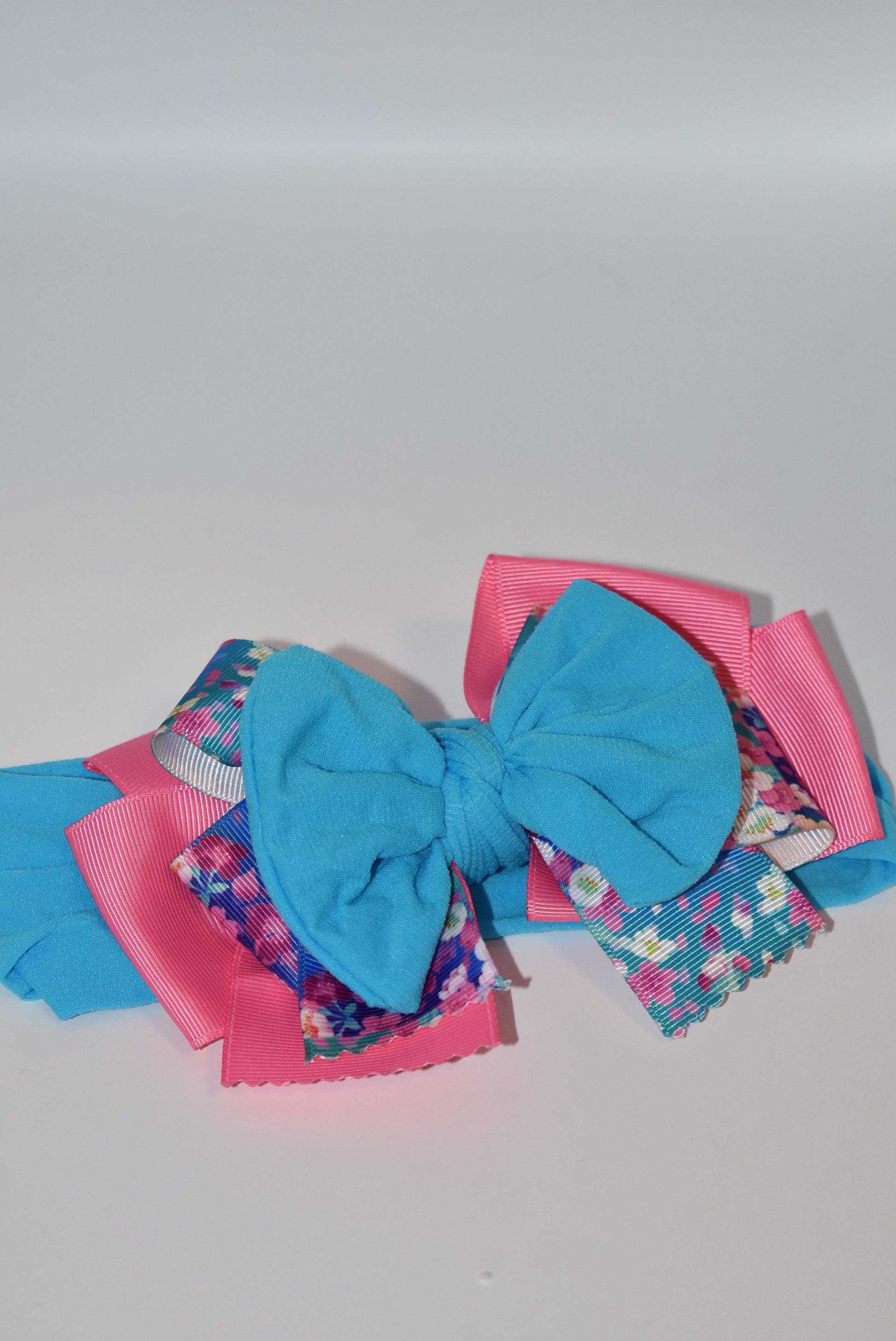 Add a splash of fun to your look with this Wrapped Headband from our Collection 4! 🎀 Featuring soft pink and blue hues and a charming flower motif 🌸, it’s perfect for anyone who loves a cheerful pop of color. One-of-a-kind and delightfully playful, this headband brightens any outfit with a touch of whimsy! ✨