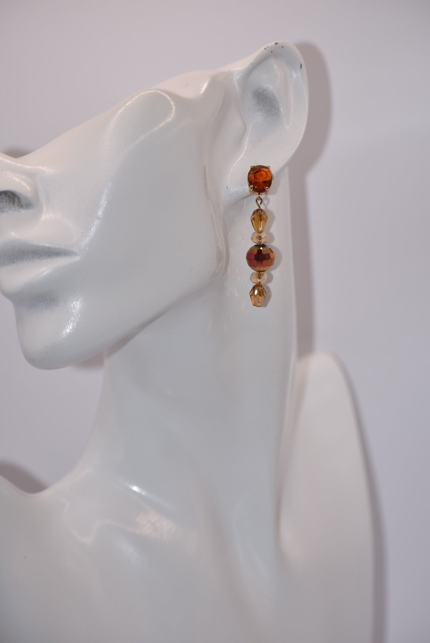 Introducing the Brown Collection - a one-of-a-kind piece that will make a statement wherever you go. These auburn gem oval post earrings are hypoallergenic, ensuring comfort for all. The beautiful crystals add a touch of sexiness and fun to your look. Don't miss out on this unique and stylish pair!