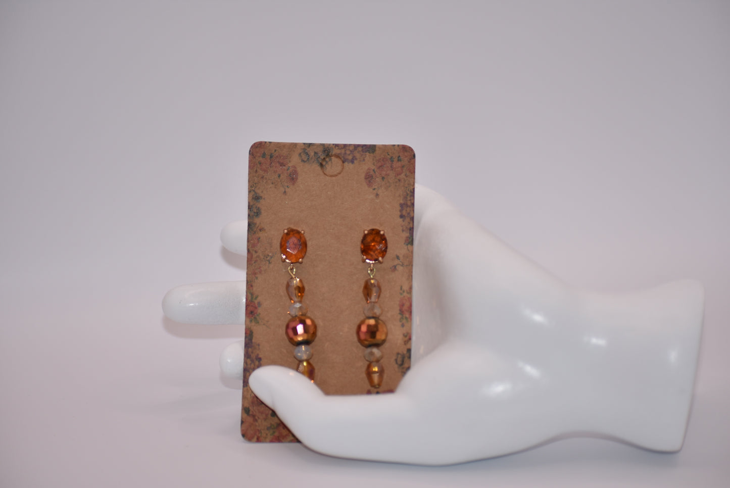 Introducing the Brown Collection - a one-of-a-kind piece that will make a statement wherever you go. These auburn gem oval post earrings are hypoallergenic, ensuring comfort for all. The beautiful crystals add a touch of sexiness and fun to your look. Don't miss out on this unique and stylish pair!