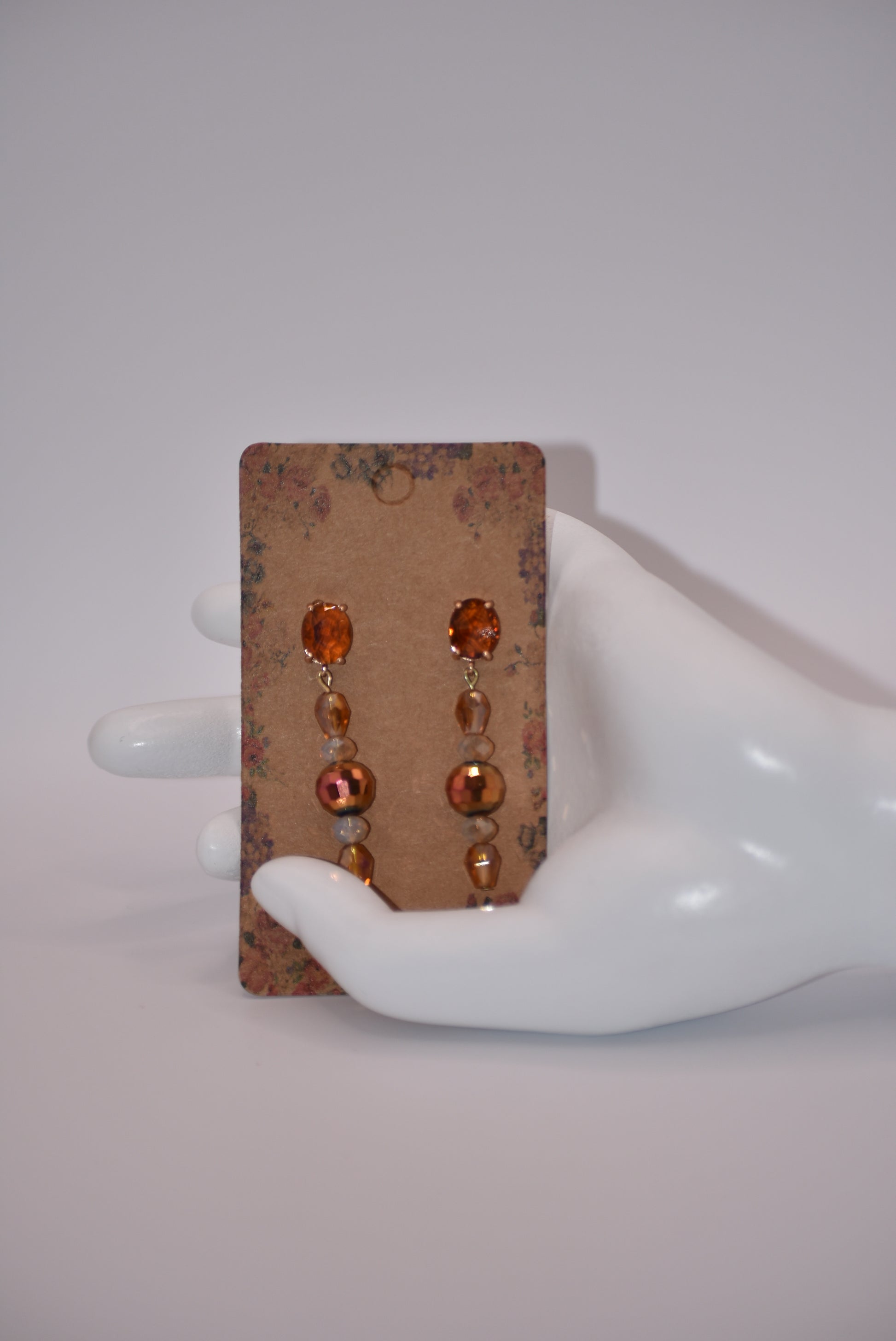 Introducing the Brown Collection - a one-of-a-kind piece that will make a statement wherever you go. These auburn gem oval post earrings are hypoallergenic, ensuring comfort for all. The beautiful crystals add a touch of sexiness and fun to your look. Don't miss out on this unique and stylish pair!